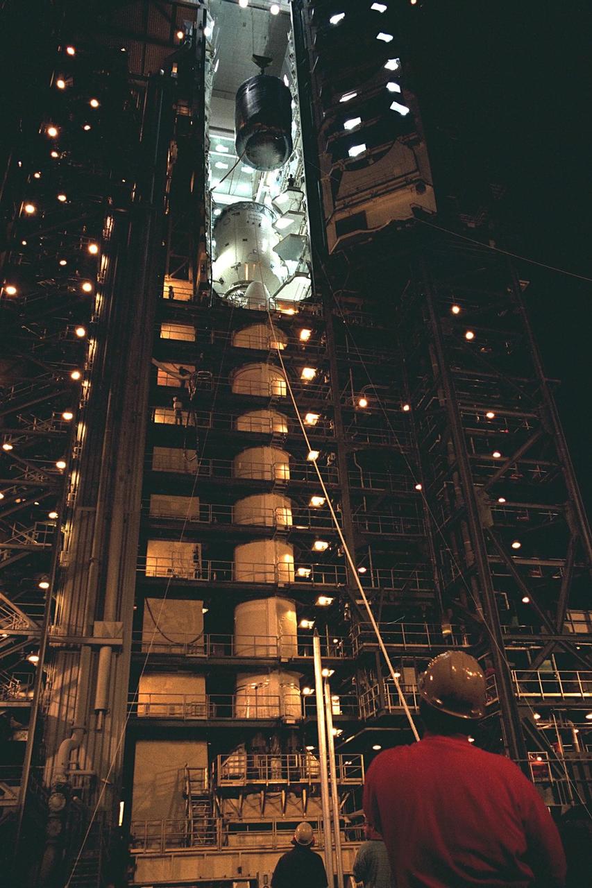 The Cassini spacecraft, with its attached Huygens probe, is lowered from Launch Pad 40 at Cape Canaveral Air Station for its return trip to the Payload Hazardous Servicing Facility (PHSF). Damage to thermal insulation was discovered inside Huygens from an abnormally high flow of conditioned air. Further internal inspection, insulation repair and a cleaning of the probe are now required. Mission managers are targeting a mid-October launch date after Cassini returns to the pad and is once again placed atop its Titan IVB expendable launch vehicle. Cassini will explore the Saturnian system, including the planet’s rings, while the Huygens probe will explore the moon Titan
