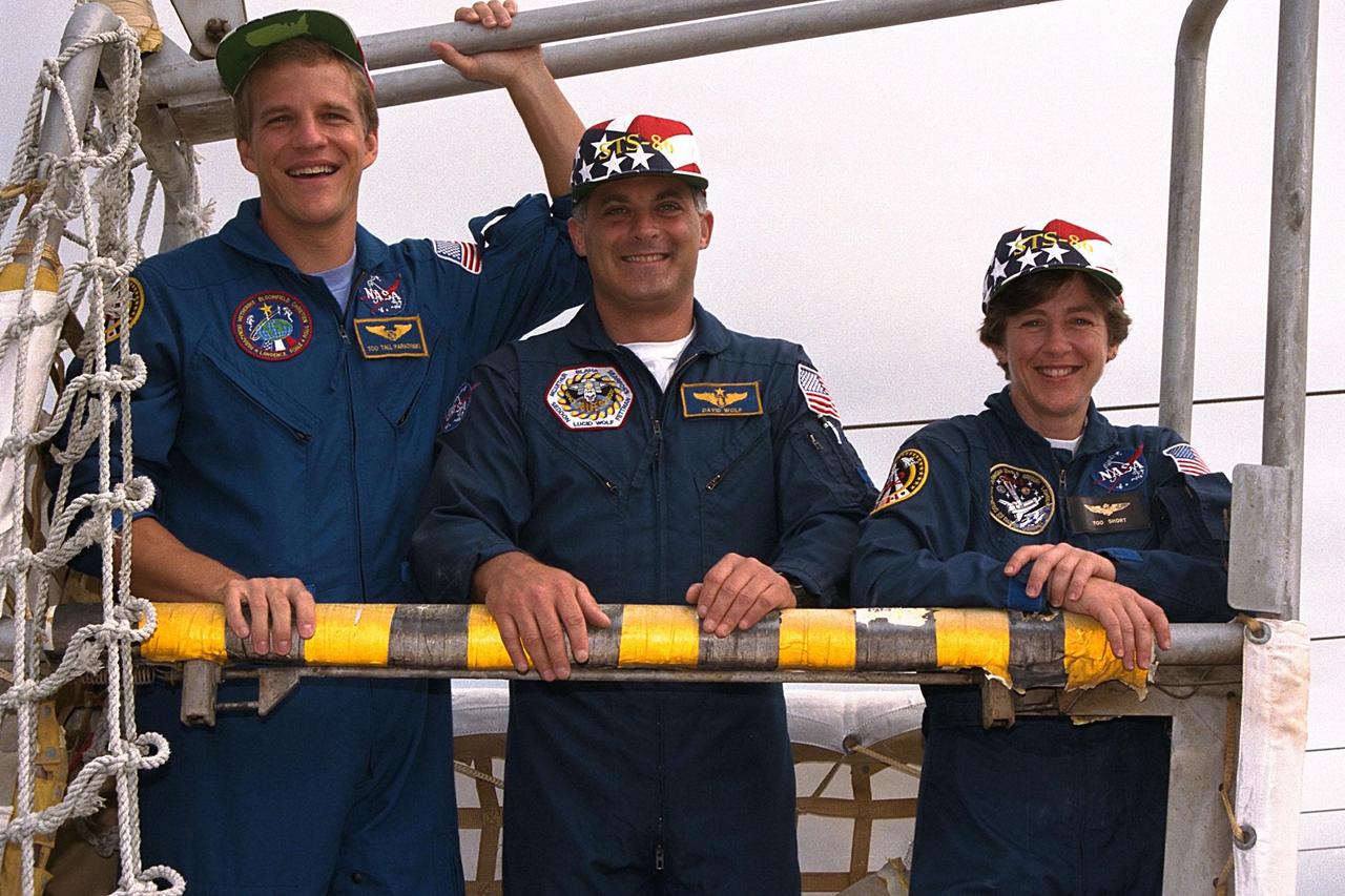 KENNEDY SPACE CENTER,  Fla. --  STS-86 Mission Specialists Scott E. Parazynski, at left, David A. Wolf, and Wendy B. Lawrence, at right, participate in emergency egress training at Launch Pad 39A as part of Terminal Countdown Demonstration Test (TCDT) activities. They are the three U.S. astronauts who will serve as mission specialists during the planned 10-day flight to the Russian Space Station Mir. Also serving as mission specialists will be Vladimir Georgievich Titov of the Russian Space Agency and Jean-Loup J.M. Chretien of the French Space Agency, CNES. STS-86 will be the seventh docking of the Space Shuttle with the Mir. During the docking, Wolf will transfer to the orbiting Russian station and become a member of the Mir 24 crew, replacing U.S. astronaut C. Michael Foale, who has been on the Mir since the last docking mission, STS-84, in May. Launch of Mission STS-86 aboard the Space Shuttle Atlantis is targeted for Sept. 25