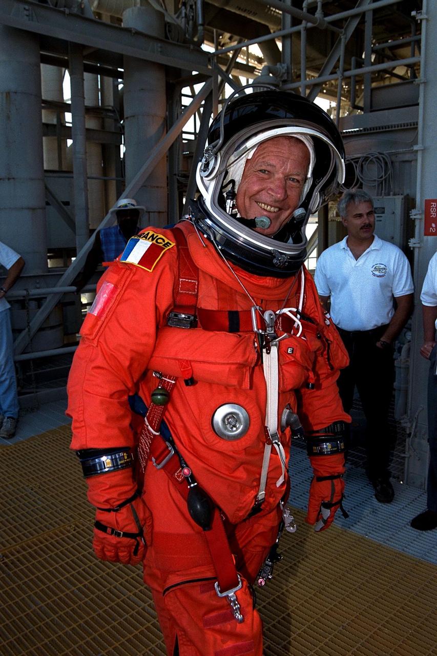 KENNEDY SPACE CENTER, Fla. -- Dressed in his orange launch and entry spacesuit, STS-86 Mission Specialist Jean-Loup J.M. Chretien of the French Space Agency, CNES, participates in Terminal Countdown Demonstration Test (TCDT) activities at Launch Pad 39A. The first Frenchman to fly in space, Chretien served twice as a research-cosmonaut on Russian missions; STS-86 will be his first flight on the Space Shuttle. STS-86 will be the seventh docking of the Space Shuttle with the Russian Space Station Mir. Liftoff of the Space Shuttle Atlantis on Mission STS-86 is targeted for Sept. 25