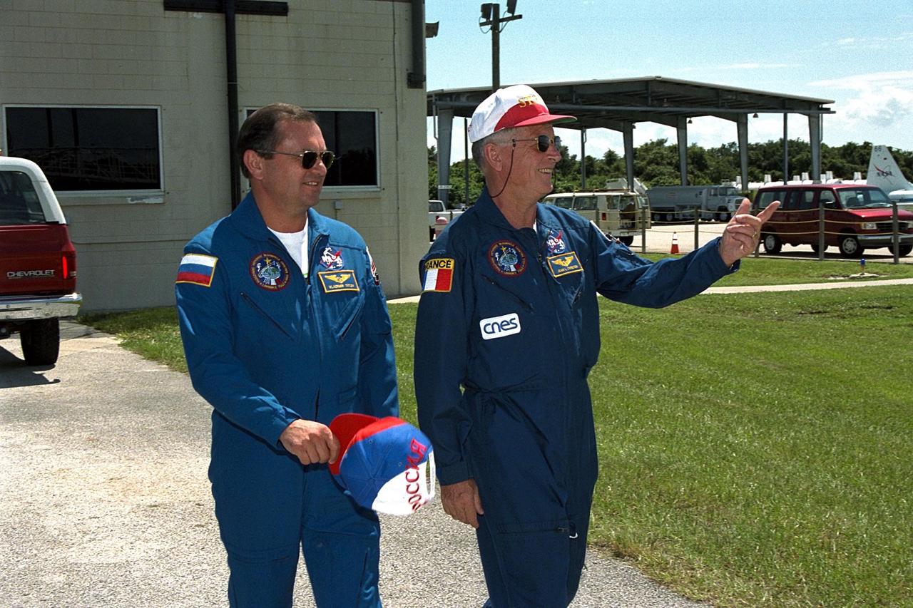 KENNEDY SPACE CENTER, Fla. -- STS-86 Mission Specialists Vladimir Georgievich Titov, at left, and Jean-Loup J.M. Chretien, the two members of the STS-86 crew representing foreign space agencies, prepare to leave from KSC’s Shuttle Landing Facility after participating in Terminal Countdown Demonstration Test (TCDT) activities. They are returning to Johnson Space Center, Houston, Texas, for final prelaunch training. Titov is a cosmonaut with the Russian Space Agency; Chretien is an astronaut with the French Space Agency, CNES. Titov will make his fifth spaceflight, and second on the Space Shuttle, on STS-86 aboard Atlantis. Chretien has flown twice before as a research-cosmonaut on Russian missions; this will be his first Shuttle mission. STS-86 will be the seventh docking of the Space Shuttle with the Russian Space Station Mir. Liftoff is targeted for Sept. 25 from Launch Pad 39A