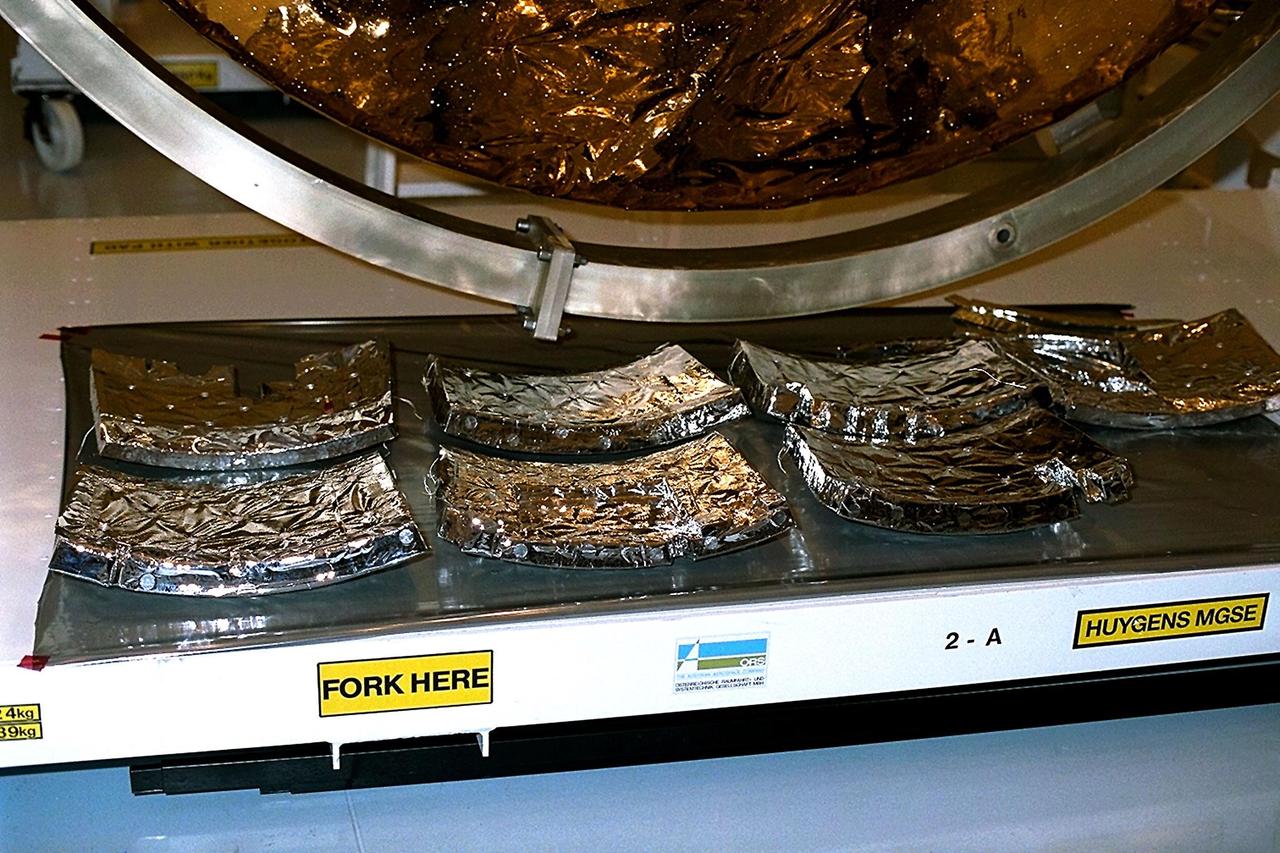 Pieces of the Huygens probe internal insulating foam await inspection after removal from the probe in the Payload Hazardous Servicing Facility (PHSF) at KSC. The spacecraft was returned to the PHSF after damage to thermal insulation was discovered inside Huygens from an abnormally high flow of conditioned air. Internal inspection, insulation repair and a cleaning of the probe were required. Mission managers are targeting a mid-October launch date after Cassini returns to the pad and is once again placed atop its Titan IVB expendable launch vehicle at Launch Pad 40 at Cape Canaveral Air Station