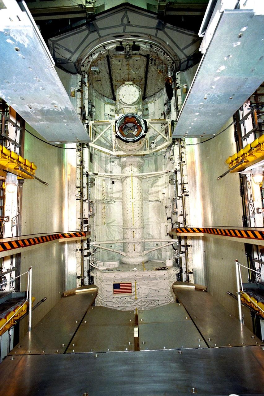 KENNEDY SPACE CENTER, FLA. -- Final preparations are under way to close the payload bay doors of the Space Shuttle Atlantis for the planned Sept. 25 liftoff of Mission STS-86. The primary payload is the SPACEHAB Double Module, part of which can be seen at top center. SPACEHAB will be used mainly as a large pressurized cargo container for the three-and-a-half tons of science/logistical equipment and supplies to be exchanged between Atlantis and the Russian Space Station Mir. STS-86 will be the seventh docking of the Space Shuttle with the Mir. The 10-day flight also is scheduled to include the transfer of the sixth American to live and work aboard the Russian orbiting outpost. Liftoff of Atlantis and its seven-member crew is targeted for 10:34 p.m. EDT from Launch Pad 39A