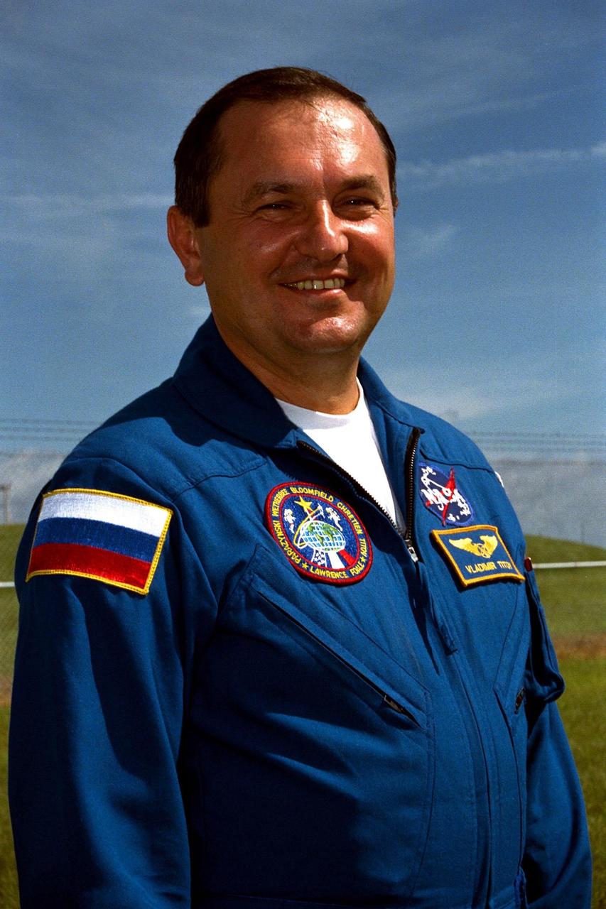 STS-86 Mission Specialist Vladimir Georgievich Titov of the Russian Space Agency stands in front of Launch Pad 39A the day before he is set to lift off on the Space Shuttle Atlantis. The seven crew members came out to the pad to greet family members, friends and other well-wishers. Space veteran Titov will be making his fifth flight, second on the Space Shuttle. The scheduled Sept. 25 launch will be the seventh docking of the Space Shuttle with the Russian Space Station Mir