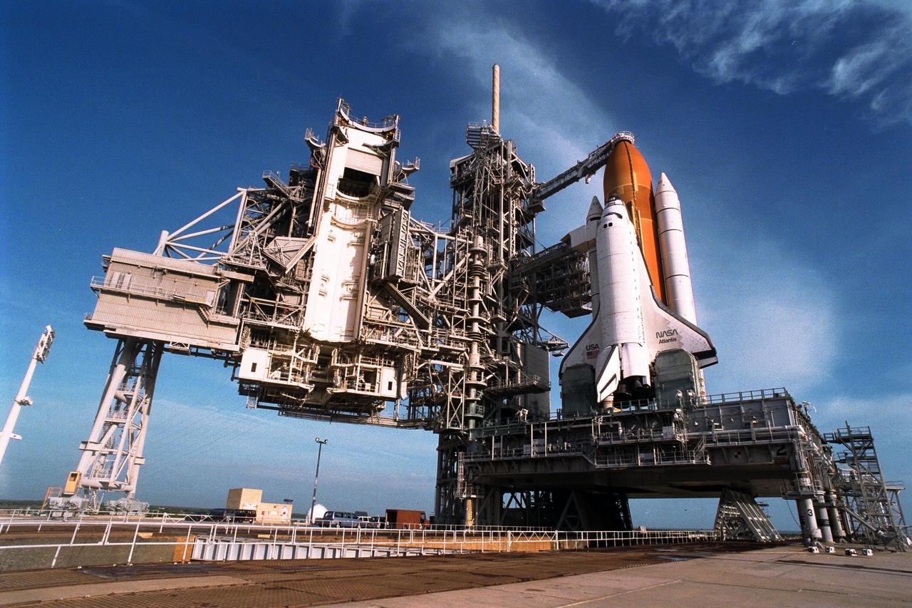 With the Rotating Service Structure rolled back, at left, the Space Shuttle Atlantis undergoes final prelaunch preparations at Launch Pad 39A for the STS-86 mission. One of the final steps will be to load the external tank with approximately 500,000 gallons of liquid hydrogen and liquid oxygen for fueling the orbiter’s three main engines. STS-86 is slated to be the seventh docking of the Space Shuttle with the Russian Space Station Mir. Liftoff is targeted for Sept. 25 at 10:34 p.m. EDT during a preferred launch window which lasts six minutes and 45 seconds. Seven crew members will lift off for the scheduled 10-day flight. One of those crew members, David A. Wolf, will transfer to the Mir for an approximate four-month stay. He will replace U.S. astronaut C. Michael Foale, who will return to Earth with the remainder of the STS86 crew. Foale has been on the Russian space station since mid-May