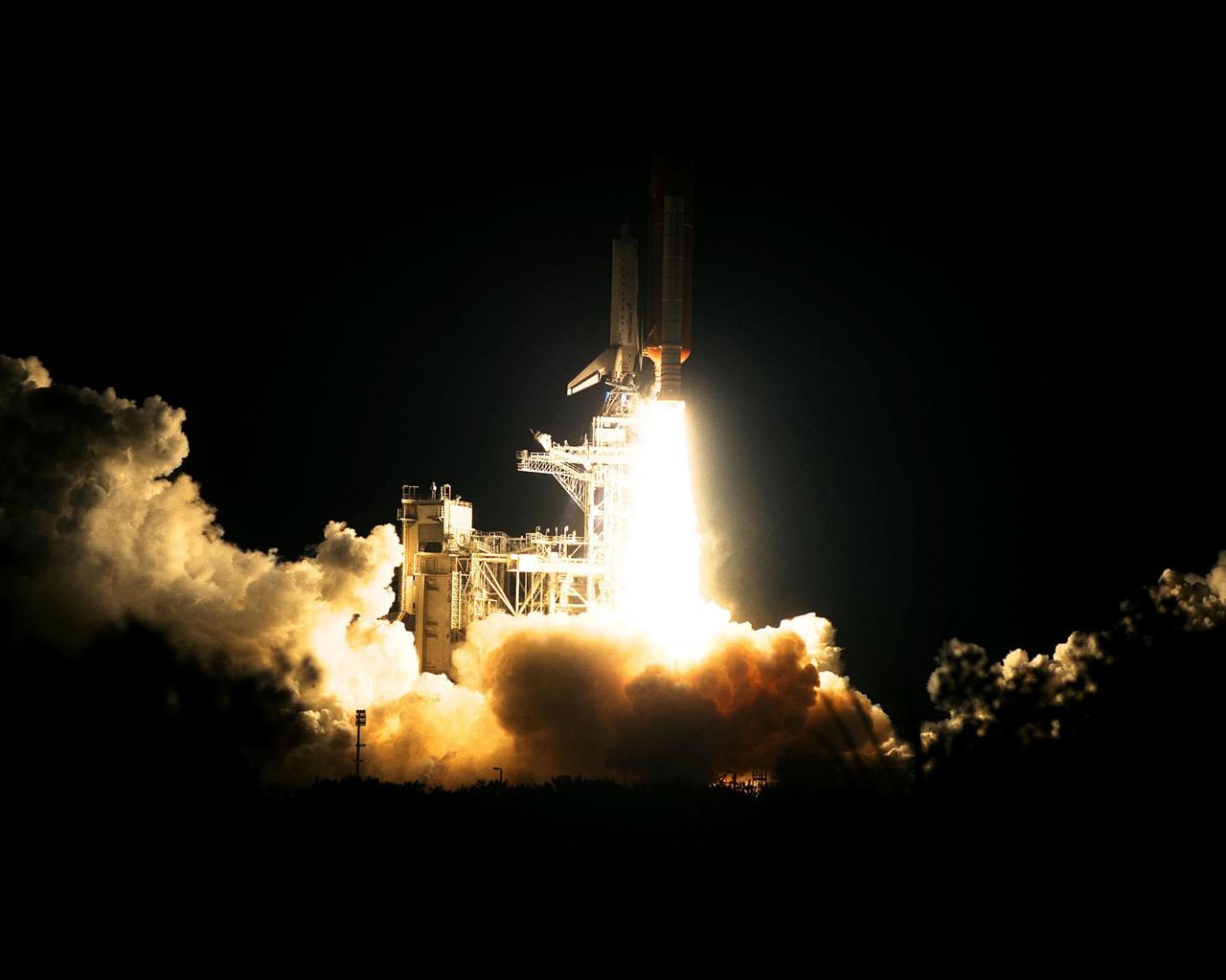 The Space Shuttle Atlantis blazes through the night sky to begin the STS-86 mission, slated to be the seventh of nine planned dockings of the Space Shuttle with the Russian Space Station Mir. Liftoff on Sept. 25 from Launch Pad 39A was at 10:34:19 p.m. EDT, within seconds of the preferred time, during a six-minute, 45-second launch window. The 10-day flight will include the transfer of the sixth U.S. astronaut to live and work aboard the Mir. After the docking, STS-86 Mission Specialist David A. Wolf will become a member of the Mir 24 crew, replacing astronaut C. Michael Foale, who will return to Earth aboard Atlantis with the remainder of the STS-86 crew. Foale has been on the Russian Space Station since mid-May. Wolf is scheduled to remain there about four months. Besides Wolf (embarking to Mir) and Foale (returning), the STS-86 crew includes Commander James D. Wetherbee, Pilot Michael J. Bloomfield, and Mission Specialists Wendy B. Lawrence, Scott E. Parazynski, Vladimir Georgievich Titov of the Russian Space Agency, and Jean-Loup J.M. Chretien of the French Space Agency, CNES. Other primary objectives of the mission are a spacewalk by Parazynski and Titov, and the exchange of about three-and-a-half tons of science/logistical equipment and supplies between Atlantis and the Mir