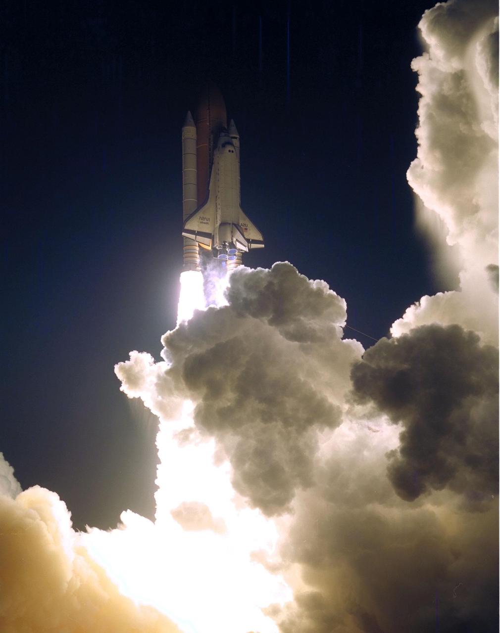 The Space Shuttle Atlantis blazes through the night sky to begin the STS-86 mission, slated to be the seventh of nine planned dockings of the Space Shuttle with the Russian Space Station Mir. Liftoff on Sept. 25 from Launch Pad 39A was at 10:34:19 p.m. EDT, within seconds of the preferred time, during a six-minute, 45-second launch window. The 10-day flight will include the transfer of the sixth U.S. astronaut to live and work aboard the Mir. After the docking, STS-86 Mission Specialist David A. Wolf will become a member of the Mir 24 crew, replacing astronaut C. Michael Foale, who will return to Earth aboard Atlantis with the remainder of the STS-86 crew. Foale has been on the Russian Space Station since mid-May. Wolf is scheduled to remain there about four months. Besides Wolf (embarking to Mir) and Foale (returning), the STS-86 crew includes Commander James D. Wetherbee, Pilot Michael J. Bloomfield, and Mission Specialists Wendy B. Lawrence, Scott E. Parazynski, Vladimir Georgievich Titov of the Russian Space Agency, and Jean-Loup J.M. Chretien of the French Space Agency, CNES. Other primary objectives of the mission are a spacewalk by Parazynski and Titov, and the exchange of about three-and-a-half tons of science/logistical equipment and supplies between Atlantis and the Mir