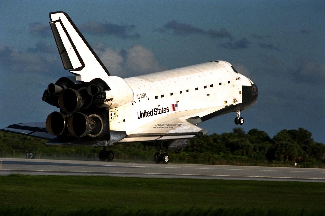 KENNEDY SPACE CENTER, Fla. -- The Space Shuttle orbiter Atlantis touches down on Runway 15 of the KSC Shuttle Landing Facility (SLF) to complete the nearly 11-day STS-86 mission. Main gear touchdown was at 5:55:09 p.m. EDT on Oct. 6, 1997. The unofficial mission-elapsed time at main gear touchdown was 10 days, 19 hours, 20 minutes and 50 seconds. The first two landing opportunities on Sunday were waved off because of weather concerns. The 87th Space Shuttle mission was the 40th landing of the Shuttle at KSC. On Sunday evening, the Space Shuttle program reached a milestone: The total flight time of the Shuttle passed the two-year mark. STS-86 was the seventh of nine planned dockings of the Space Shuttle with the Russian Space Station Mir. STS-86 Mission Specialist David A. Wolf replaced NASA astronaut and Mir 24 crew member C. Michael Foale, who has been on the Mir since mid-May. Foale returned to Earth on Atlantis with the remainder of the STS-86 crew. The other crew members are Commander James D. Wetherbee, Pilot Michael J. Bloomfield, and Mission Specialists Wendy B. Lawrence, Scott E. Parazynski, Vladimir Georgievich Titov of the Russian Space Agency, and Jean-Loup J.M. Chretien of the French Space Agency, CNES. Wolf is scheduled to remain on the Mir until the STS-89 Shuttle mission in January. Besides the docking and crew exchange, STS-86 included the transfer of more than three-and-ahalf tons of science/logistical equipment and supplies between the two orbiting spacecraft. Parazynski and Titov also conducted a spacewalk while Atlantis and the Mir were docked