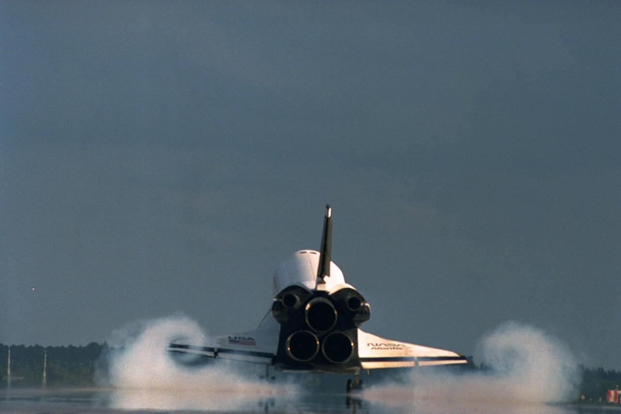 KENNEDY SPACE CENTER, Fla. -- The Space Shuttle orbiter Atlantis touches down on Runway 15 of the KSC Shuttle Landing Facility (SLF) to complete the nearly 11-day STS-86 mission. Main gear touchdown was at 5:55:09 p.m. EDT on Oct. 6, 1997. The unofficial mission-elapsed time at main gear touchdown was 10 days, 19 hours, 20 minutes and 50 seconds. The first two landing opportunities on Sunday were waved off because of weather concerns. The 87th Space Shuttle mission was the 40th landing of the Shuttle at KSC. On Sunday evening, the Space Shuttle program reached a milestone: The total flight time of the Shuttle passed the two-year mark. STS-86 was the seventh of nine planned dockings of the Space Shuttle with the Russian Space Station Mir. STS-86 Mission Specialist David A. Wolf replaced NASA astronaut and Mir 24 crew member C. Michael Foale, who has been on the Mir since mid-May. Foale returned to Earth on Atlantis with the remainder of the STS-86 crew. The other crew members are Commander James D. Wetherbee, Pilot Michael J. Bloomfield, and Mission Specialists Wendy B. Lawrence, Scott E. Parazynski, Vladimir Georgievich Titov of the Russian Space Agency, and Jean-Loup J.M. Chretien of the French Space Agency, CNES. Wolf is scheduled to remain on the Mir until the STS-89 Shuttle mission in January. Besides the docking and crew exchange, STS-86 included the transfer of more than three-and-ahalf tons of science/logistical equipment and supplies between the two orbiting spacecraft. Parazynski and Titov also conducted a spacewalk while Atlantis and the Mir were docked