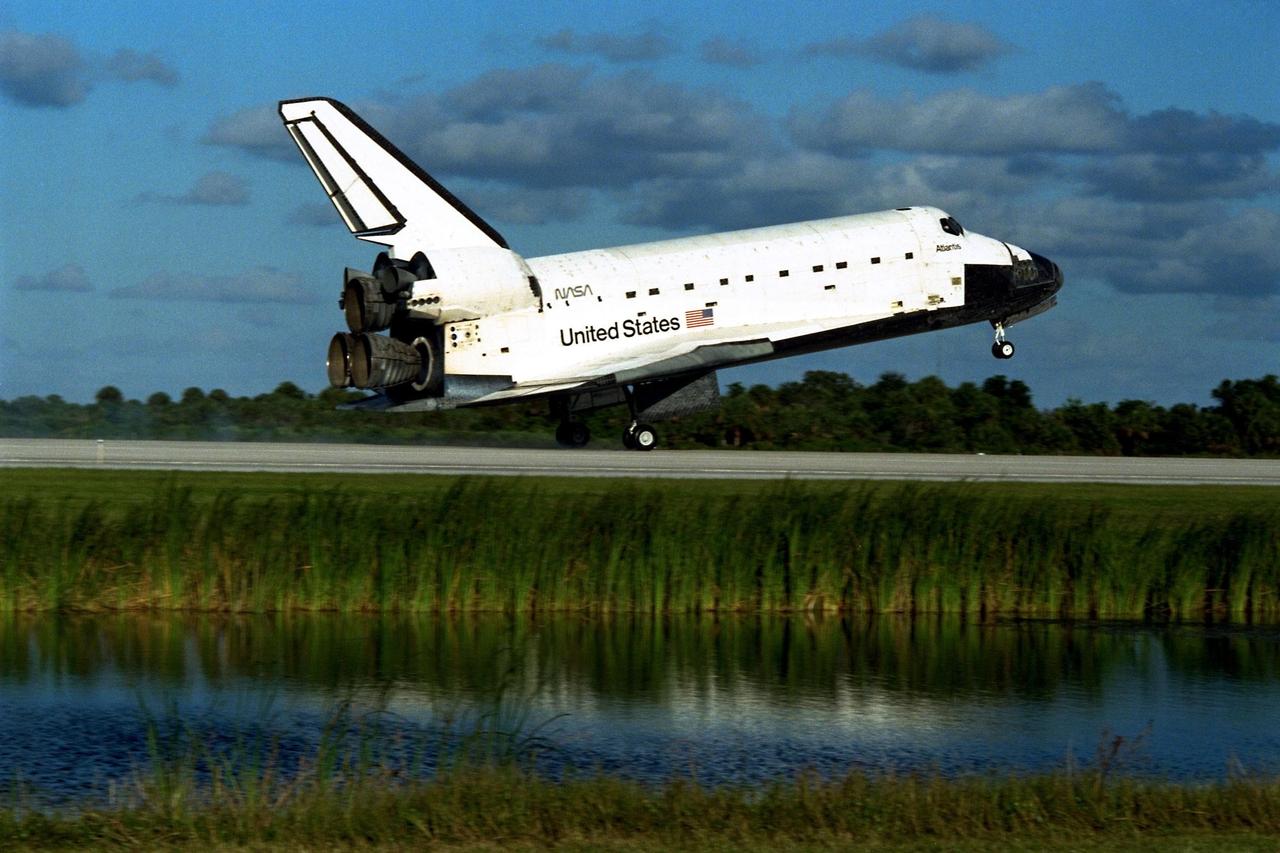 The Space Shuttle orbiter Atlantis touches down on Runway 15 of the KSC Shuttle Landing Facility (SLF) to complete the nearly 11-day STS-86 mission. Main gear touchdown was at 5:55:09 p.m. EDT on Oct. 6, 1997. The unofficial mission-elapsed time at main gear touchdown was 10 days, 19 hours, 20 minutes and 50 seconds. The first two landing opportunities on Sunday were waved off because of weather concerns. The 87th Space Shuttle mission was the 40th landing of the Shuttle at KSC. On Sunday evening, the Space Shuttle program reached a milestone: The total flight time of the Shuttle passed the two-year mark. STS-86 was the seventh of nine planned dockings of the Space Shuttle with the Russian Space Station Mir. STS-86 Mission Specialist David A. Wolf replaced NASA astronaut and Mir 24 crew member C. Michael Foale, who has been on the Mir since mid-May. Foale returned to Earth on Atlantis with the remainder of the STS-86 crew. The other crew members are Commander James D. Wetherbee, Pilot Michael J. Bloomfield, and Mission Specialists Wendy B. Lawrence, Scott E. Parazynski, Vladimir Georgievich Titov of the Russian Space Agency, and Jean-Loup J.M. Chretien of the French Space Agency, CNES. Wolf is scheduled to remain on the Mir until the STS-89 Shuttle mission in January. Besides the docking and crew exchange, STS-86 included the transfer of more than three-and-ahalf tons of science/logistical equipment and supplies between the two orbiting spacecraft. Parazynski and Titov also conducted a spacewalk while Atlantis and the Mir were docked