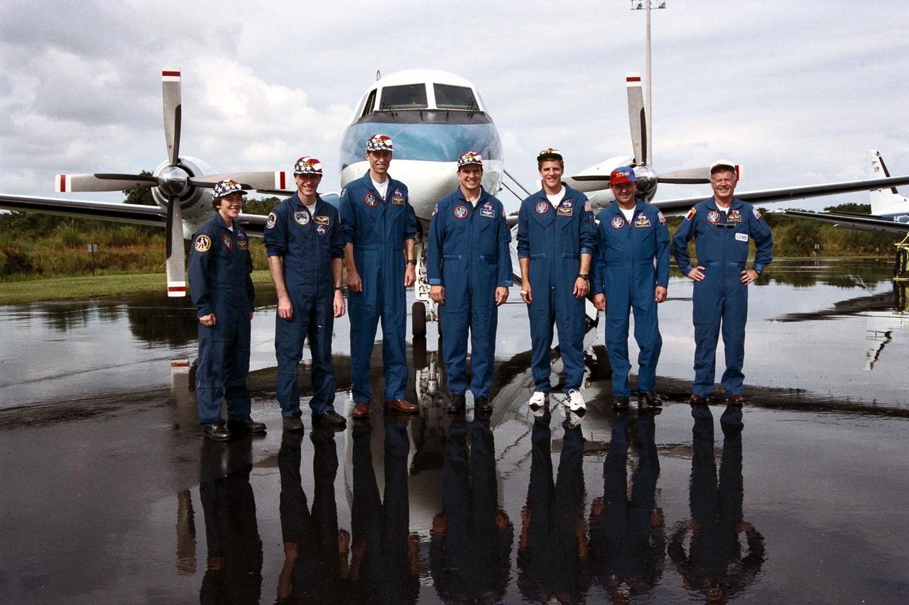 Members of the STS-86 crew pose for a last photograph at the Skid Strip on Cape Canaveral Air Station before flying back to their home base at the Johnson Space Center in Houston, Texas. From left, are Mission Specialist Wendy B. Lawrence, Mission Specialist and recent Mir 24 crew member C. Michael Foale, Commander James D. Wetherbee, Pilot Michael J. Bloomfield, and Mission Specialists Scott E. Parazynski, Vladimir Georgievich Titov of the Russian Space Agency and Jean-Loup J.M. Chretien of the French Space Agency, CNES. Foale, who was on the Russian Space Station Mir since mid-May, returned to Earth aboard the Space Shuttle orbiter Atlantis at the Oct. 6 KSC landing of Mission STS-86. He was replaced on the Mir by STS-86 Mission Specialist David A. Wolf, who is scheduled to remain there until mid-January
