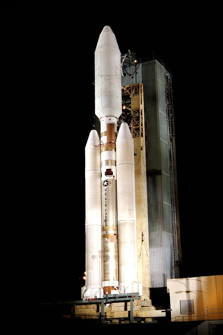 At Launch Complex 40 on Cape Canaveral Air Station, the Mobile Service Tower has been retracted away from the Titan IVB/Centaur carrying the Cassini spacecraft and its attached Huygens probe. This is the second launch attempt for the Saturn-bound mission; a first try Oct. 13 was scrubbed primarily due to concerns about upper level wind conditions. Liftoff Oct. 15 is set to occur during a launch window opening at 4:43 a.m. EDT and extending until 7:03 a.m. Clearly visible in this view are the 66-foot-tall, 17-foot-wide payload fairing atop the vehicle, in which Cassini and the attached Centaur stage are encased, the two-stage liquid propellant core vehicle, and the twin 112-foot long solid rocket motor upgrades (SRMUs) straddling the core vehicle. It is the SRMUs which ignite first to begin the launch sequence
