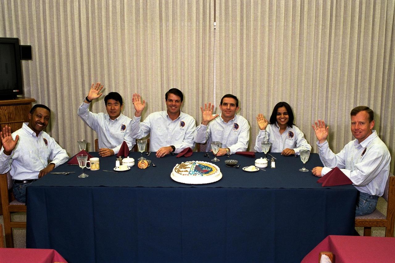 The STS-87 flight crew enjoy the traditional pre-liftoff breakfast in the crew quarters of the Operations and Checkout Building. They are, from left, Mission Specialist Winston Scott; Mission Specialist Takao Doi, Ph.D., of the National Space Development Agency of Japan; Commander Kevin Kregel; Payload Specialist Leonid Kadenyuk of the National Space Agency of Ukraine; Mission Specialist Kalpana Chawla, Ph.D.; and Pilot Steven Lindsey. After a weather briefing, the flight crew will be fitted with their launch and entry suits and depart for Launch Pad 39B. Once there, they will take their positions in the crew cabin of the Space Shuttle Columbia to await liftoff during a two-and-a-half-hour window that will open at 2:46 p.m. EDT, Nov. 19