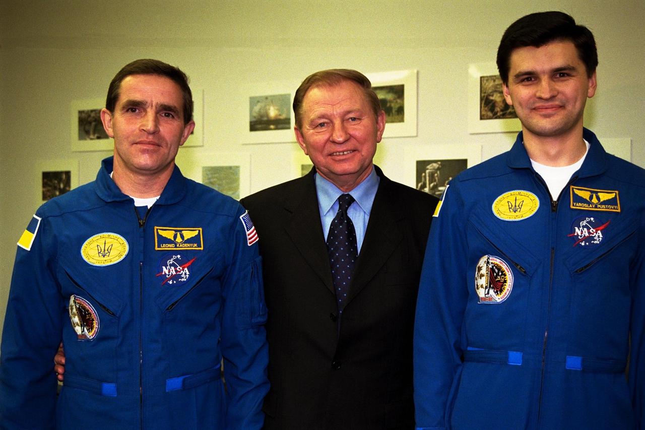 The president of the Ukraine, Leonid Kuchma, is flanked by Payload Specialist Leonid Kadenyuk, at left, and backup Payload Specialist Yaroslav Pustovyi, at right, both of the National Space Agency of Ukraine, during prelaunch activities leading up to the scheduled Nov. 19 launch of STS-87. STS-87 will be the fourth flight of the United States Microgravity Payload and the Spartan-201 deployable satellite. During the mission, Kadenyuk will pollinate Brassica rapa plants as part of the Collaborative Ukrainian Experiment, or CUE, aboard Columbia during its 16-day mission. The CUE experiment is a collection of 10 plant space biology experiments that will fly in Columbia's middeck and will feature an educational component that involves evaluating the effects of microgravity on Brassica rapa seedlings. Students in Ukrainian and American schools will participate in the same experiment with Kadenyuk in space. Kadenyuk will be flying his first Shuttle mission on STS-87
