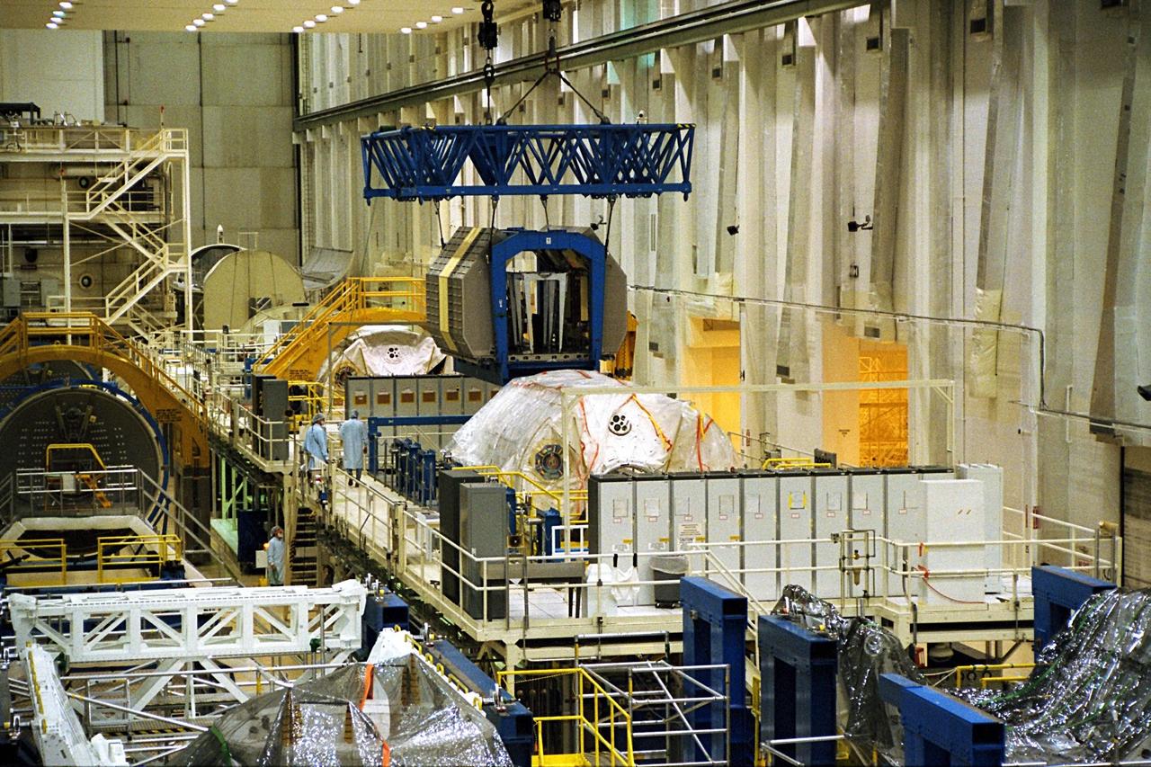 The Neurolab payload for STS-90, scheduled to launch aboard the Shuttle Columbia from Kennedy Space Center (KSC) on April 2, 1998, is moved to its workstand in the Operations and Checkout Building at KSC. Investigations during the Neurolab mission will focus on the effects of microgravity on the nervous system. Specifically, experiments will study the adaptation of the vestibular system, the central nervous system, and the pathways that control the ability to sense location in the absence of gravity, as well as the effect of microgravity on a developing nervous system. The crew of STS-90 will include Commander Richard Searfoss, Pilot Scott Altman, Mission Specialists Richard Linnehan, Dafydd (Dave) Williams, M.D., and Kathryn (Kay) Hire, and Payload Specialists Jay Buckey, M.D., and James Pawelczyk, Ph.D