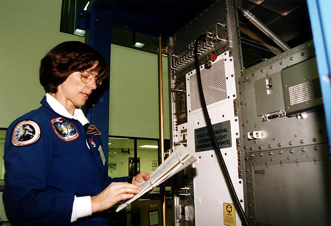 KENNEDY SPACE CENTER, FLA. -- STS-89 Mission Specialist Bonnie Dunbar, Ph.D., participates in the Crew Equipment Interface Test (CEIT) in front of the Real-time Radiation Monitoring Device (RRMD) at the SPACEHAB Payload Processing Facility at Port Canaveral in preparation for the mission, slated to be the first Shuttle launch of 1998. The CEIT gives astronauts an opportunity to get a hands-on look at the payloads with which they will be working on-orbit. STS-89 will be the eighth of nine scheduled Mir dockings and will include a double module of SPACEHAB, used mainly as a large pressurized cargo container for science, logistical equipment and supplies to be exchanged between the orbiter Endeavour and the Russian Space Station Mir. The nineday flight of STS-89 also is scheduled to include the transfer of the seventh American to live and work aboard the Russian orbiting outpost. Liftoff of Endeavour and its sevenmember crew is targeted for Jan. 15, 1998, at 1:03 a.m. EDT from Launch Pad 39A