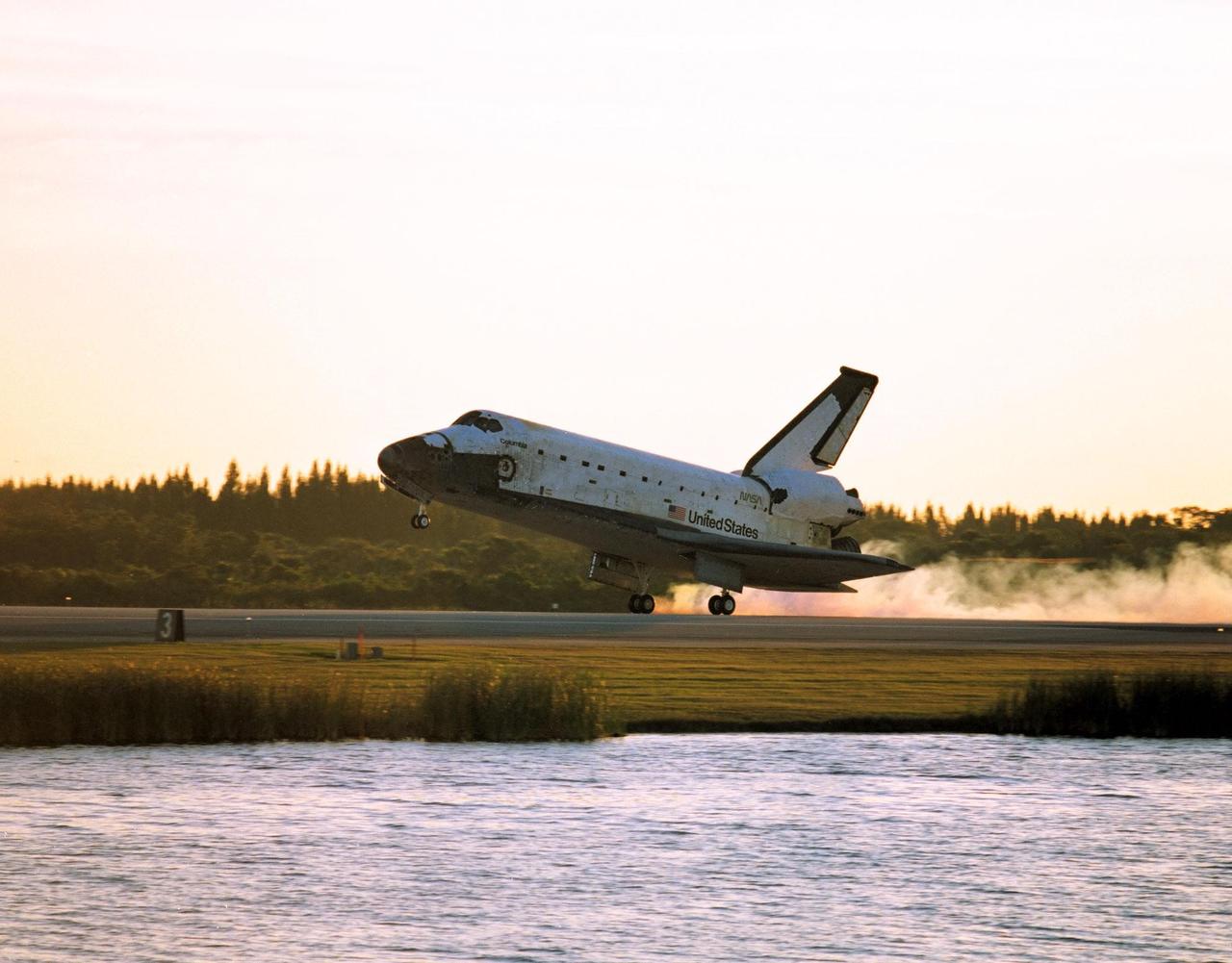 With Commander Kevin Kregel and Pilot Steven Lindsey at the controls, the orbiter Columbia touches its main gear down on Runway 33 at KSC’s Shuttle Landing Facility at 7:20:04 a.m. EST Dec. 5 to complete the 15-day, 16-hour and 34-minute-long STS-87 mission of 6.5 million miles. Also onboard the orbiter are Mission Specialists Winston Scott; Kalpana Chawla, Ph.D.; and Takao Doi, Ph.D., of the National Space Development Agency of Japan; along with Payload Specialist Leonid Kadenyuk of the National Space Agency of Ukraine. During the 88th Space Shuttle mission, the crew performed experiments on the United States Microgravity Payload-4 and pollinated plants as part of the Collaborative Ukrainian Experiment. This was the 12th landing for Columbia at KSC and the 41st KSC landing in the history of the Space Shuttle program