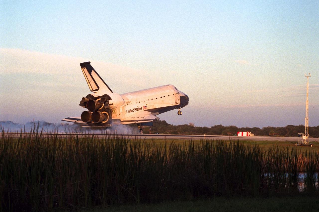 With Commander Kevin Kregel and Pilot Steven Lindsey at the controls, the orbiter Columbia makes a smooth touchdown on Runway 33 at KSC’s Shuttle Landing Facility at 7:20:04 a.m. EST Dec. 5, completing the 15-day, 16-hour and 34-minute-long STS-87 mission of 6.5 million miles. Also onboard the orbiter are Mission Specialists Winston Scott; Kalpana Chawla, Ph.D.; and Takao Doi, Ph.D., of the National Space Development Agency of Japan; along with Payload Specialist Leonid Kadenyuk of the National Space Agency of Ukraine. During the 88th Space Shuttle mission, the crew performed experiments on the United States Microgravity Payload-4 and pollinated plants as part of the Collaborative Ukrainian Experiment. This was the 12th landing for Columbia at KSC and the 41st KSC landing in the history of the Space Shuttle program