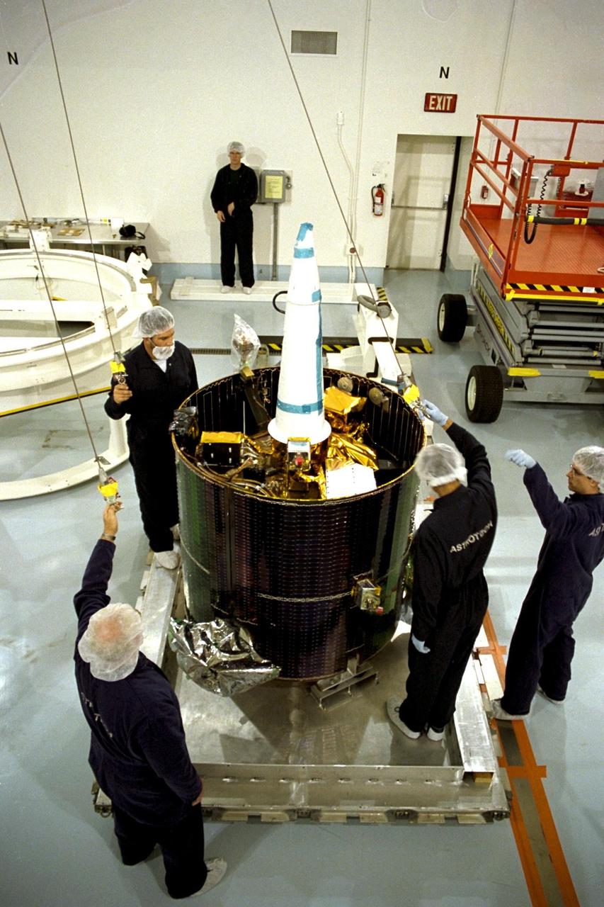 NASA's Lunar Prospector is taken out of its crate at Astrotech, a commercial payload processing facility, in Titusville, Fla. The small robotic spacecraft, to be launched for NASA on an Athena 2 rocket by Lockheed Martin, is designed to provide the first global maps of the Moon's surface compositional elements and its gravitational and magnetic fields. While at Astrotech, Lunar Prospector will be fueled with its attitude control propellant and then mated to a Trans-Lunar Injection Stage which is a solid propellant upper stage motor. The combination will next be spin tested to verify proper balance, then encapsulated into an Athena nose fairing. Then the Lunar Prospector will be transported from Astrotech to Cape Canaveral Air Station and mated to an Athena rocket. The launch of Lunar Prospector is scheduled for Jan. 5, 1998 at 8:31 p.m