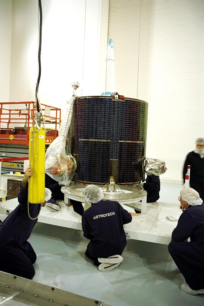 NASA's Lunar Prospector is taken out of its crate at Astrotech, a commercial payload processing facility, in Titusville, Fla. The small robotic spacecraft, to be launched for NASA on an Athena 2 rocket by Lockheed Martin, is designed to provide the first global maps of the Moon's surface compositional elements and its gravitational and magnetic fields. While at Astrotech, Lunar Prospector will be fueled with its attitude control propellant and then mated to a Trans-Lunar Injection Stage which is a solid propellant upper stage motor. The combination will next be spin tested to verify proper balance, then encapsulated into an Athena nose fairing. Then the Lunar Prospector will be transported from Astrotech to Cape Canaveral Air Station and mated to an Athena rocket. The launch of Lunar Prospector is scheduled for Jan. 5, 1998 at 8:31 p.m