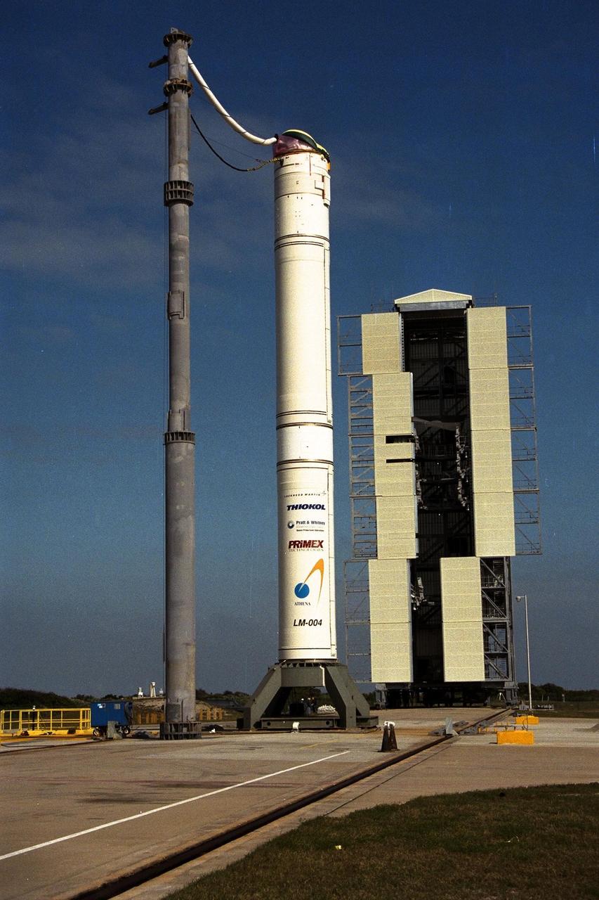 The access tower around the Athena II rocket for the Lunar Prospector spacecraft, to be launched for NASA by Lockheed Martin, was rolled back today at Launch Complex 46 at Cape Canaveral Air Station for final prelaunch preparations. The small robotic spacecraft is designed to provide the first global maps of the Moon's surface compositional elements and its gravitational and magnetic fields. The launch of Lunar Prospector is currently scheduled for Jan. 5, 1998 at 8:31 p.m