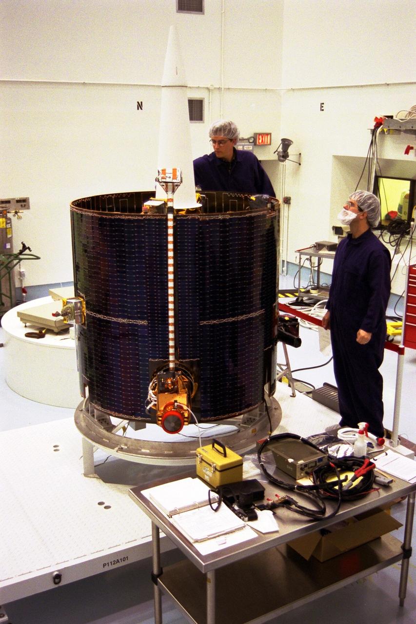 Lockheed Martin Missile Systems technicians prepare NASA’s Lunar Prospector spacecraft for mating to the Trans Lunar Injection Module of the spacecraft at Astrotech, a commercial payload processing facility, in Titusville, Fla. The small robotic spacecraft, to be launched for NASA on an Athena II launch vehicle by Lockheed Martin, is designed to provide the first global maps of the Moon’s surface compositional elements and its gravitational and magnetic fields. The launch of Lunar Prospector is scheduled for Jan. 5, 1998 at 8:31 p.m