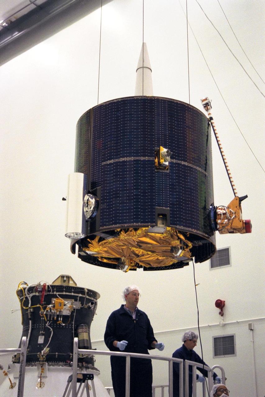 Lockheed Martin Missile Systems integration and test staff prepare NASA’s Lunar Prospector spacecraft for mating to the Trans Lunar Injection Module of the spacecraft at Astrotech, a commercial payload processing facility, in Titusville, Fla. The small robotic spacecraft, to be launched for NASA on an Athena II launch vehicle by Lockheed Martin, is designed to provide the first global maps of the Moon’s surface compositional elements and its gravitational and magnetic fields. The launch of Lunar Prospector is scheduled for Jan. 5, 1998 at 8:31 p.m
