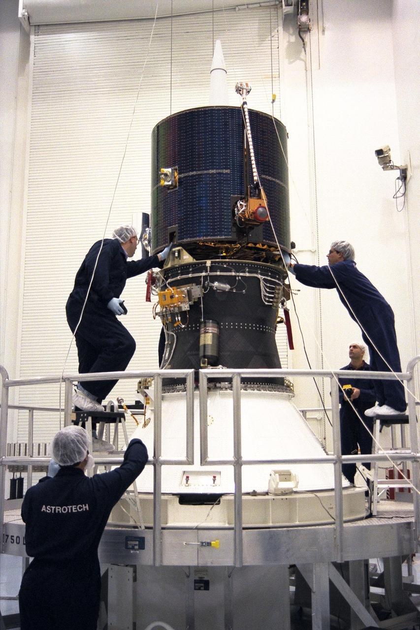 Lockheed Martin Missile Systems integration and test staff join NASA’s Lunar Prospector spacecraft to the Trans Lunar Injection Module of the spacecraft at Astrotech, a commercial payload processing facility, in Titusville, Fla. The small robotic spacecraft, to be launched on an Athena II launch vehicle by Lockheed Martin, is designed to provide the first global maps of the Moon’s surface compositional elements and its gravitational and magnetic fields. The launch of Lunar Prospector is scheduled for Jan. 5, 1998 at 8:31 p.m