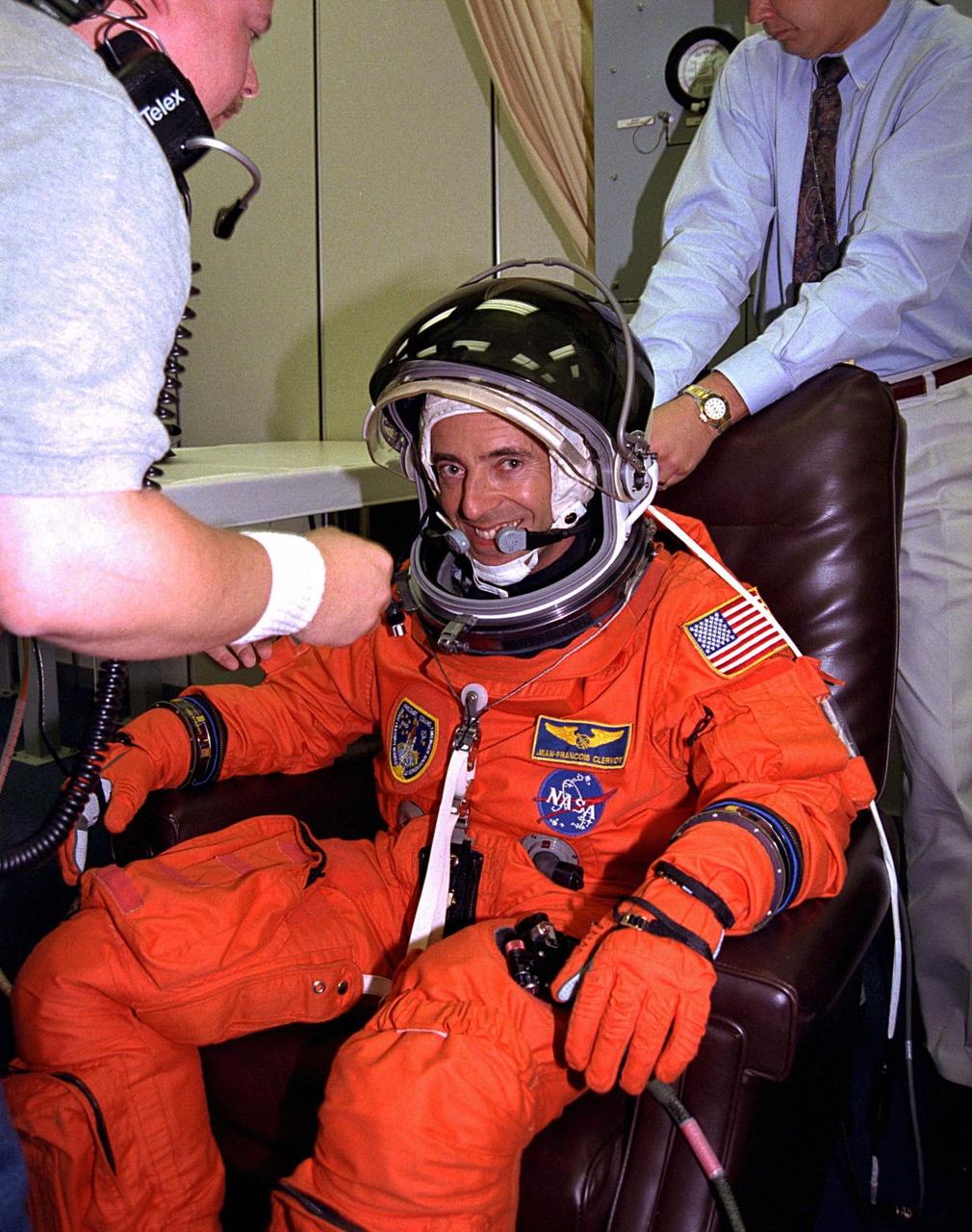 Assisted by suit technicians and others in the Operations and Checkout Building, STS-84 Mission Specialist Jean-Francois Clervoy dons his launch and entry suit during final prelaunch preparations. Clervoy is an astronaut with the European Space Agency. This will his second Space Shuttle flight. Clervoy and six other crew members will depart shortly for Launch Pad 39A, where the Space Shuttle Atlantis awaits liftoff on a mission to dock with the Russian Space Station Mir