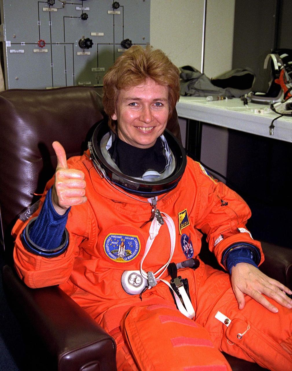 STS-84 Mission Specialist Elena V. Kondakova gives a "thumbs up" as she dons her launch and entry suit during final prelaunch preparations in the Operations and Checkout Building. Kondakova is a cosmonaut with the Russian Space Agency. This is her second trip into space, but her first on the Space Shuttle. She spent 169 days in space as flight engineer of the 17th main mission on the Russian Space Station Mir from Oct. 4, 1994, to March 9, 1995. STS-84 aboard Atlantis will be the sixth docking of the Space Shuttle with the Mir