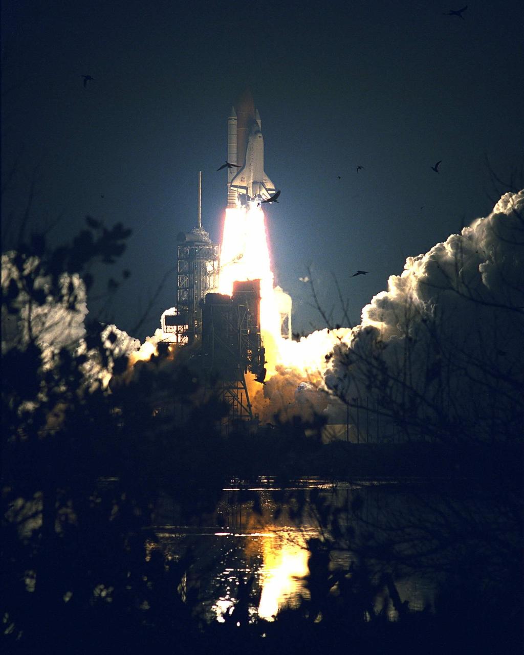 The Space Shuttle Atlantis turns night into day for a few moments as it lifts off on May 15 at 4:07:48 a.m. EDT from Launch Pad 39A on the STS-84 mission. The fourth Shuttle mission of 1997 will be the sixth docking of the Space Shuttle with the Russian Space Station Mir. The commander is Charles J. Precourt. The pilot is Eileen Marie Collins. The five mission specialists are C. Michael Foale, Carlos I. Noriega, Edward Tsang Lu, Jean-Francois Clervoy of the European Space Agency and Elena V. Kondakova of the Russian Space Agency. The planned nine-day mission will include the exchange of Foale for U.S. astronaut and Mir 23 crew member Jerry M. Linenger, who has been on Mir since Jan. 15. Linenger transferred to Mir during the last docking mission, STS-81; he will return to Earth on Atlantis. Foale is slated to remain on Mir for about four months until he is replaced in September by STS-86 Mission Specialist Wendy B. Lawrence. During the five days Atlantis is scheduled to be docked with the Mir, the STS-84 crew and the Mir 23 crew, including two Russian cosmonauts, Commander Vasily Tsibliev and Flight Engineer Alexander Lazutkin, will participate in joint experiments. The STS-84 mission also will involve the transfer of more than 7,300 pounds of water, logistics and science equipment to and from the Mir. Atlantis is carrying a nearly 300-pound oxygen generator to replace one of two Mir units which have experienced malfunctions. The oxygen it generates is used for breathing by the Mir crew