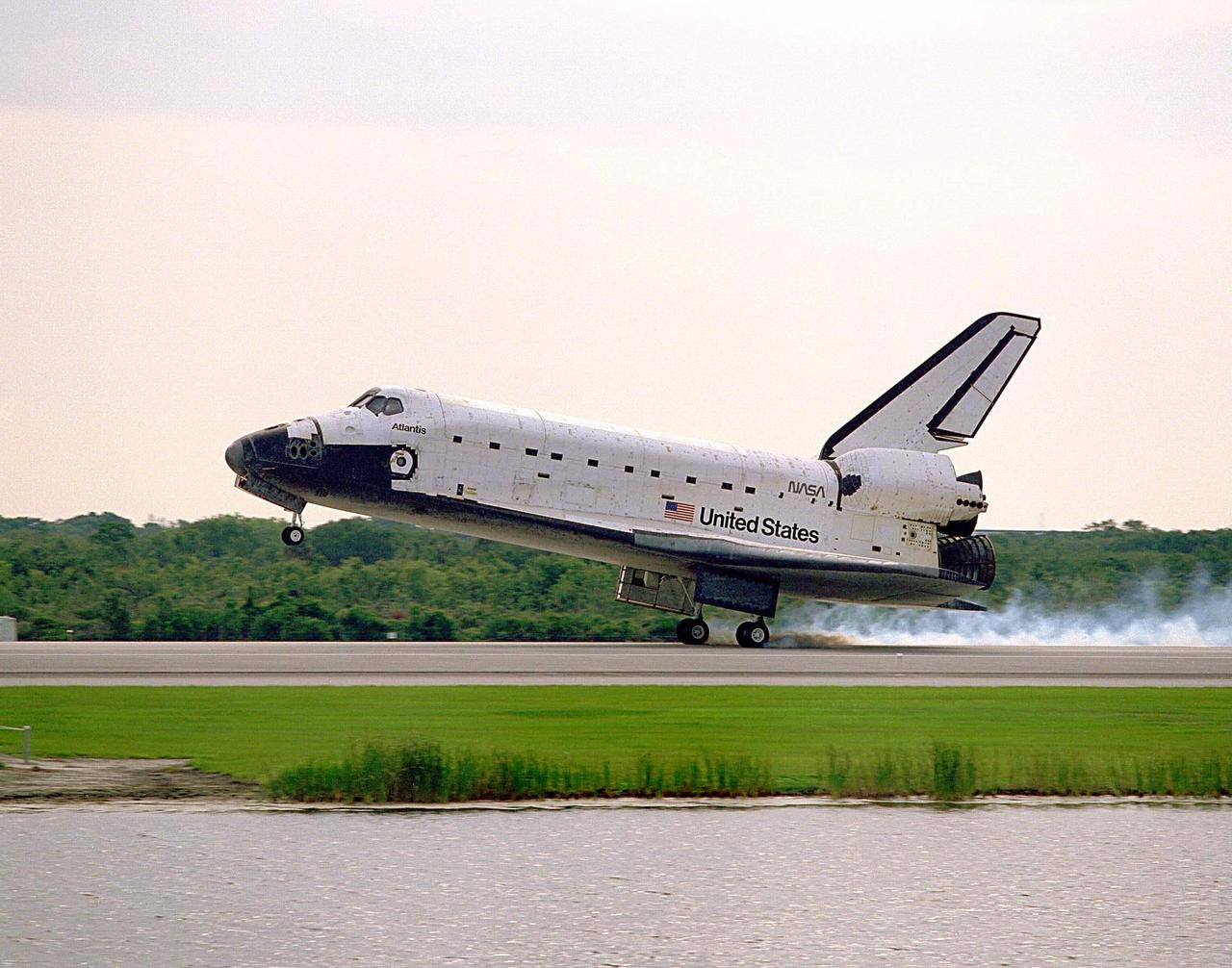 The Space Shuttle orbiter Atlantis touches down on Runway 33 of the KSC Shuttle Landing Facility, bringing to an end the nine-day STS-84 mission. Main gear touchdown was at 9:27:44 EDT on May 24, 1997. The first landing opportunity was waved off because of low cloud cover. It was the 37th landing at KSC since the Shuttle program began in 1981, and the eighth consecutive landing at KSC. STS-84 was the sixth of nine planned dockings of the Space Shuttle with the Russian Space Station Mir. Atlantis was docked with the Mir for five days. STS-84 Mission Specialist C. Michael Foale replaced astronaut and Mir 23 crew member Jerry M. Linenger, who has been on the Russian space station since Jan. 15. Linenger returned to Earth on Atlantis with the rest of the STS-84 crew, Mission Commander Charles J. Precourt, Pilot Eileen Marie Collins, and Mission Specialists Carlos I. Noriega, Edward Tsang Lu, Elena V. Kondakova of the Russian Space Agency and JeanFrancois Clervoy of the European Space Agency. Foale is scheduled to remain on the Mir for approximately four months, until he is replaced by STS-86 crew member Wendy B. Lawrence in September. Besides the docking and crew exchange, STS-84 included the transfer of more than 7,300 pounds of water, logistics and science experiments and hardware to and from the Mir. Scientific experiments conducted during the STS-84 mission, and scheduled for Foale’s stay on the Mir, are in the fields of advanced technology, Earth sciences, fundamental biology, human life sciences, International Space Station risk mitigation, microgravity sciences and space sciences