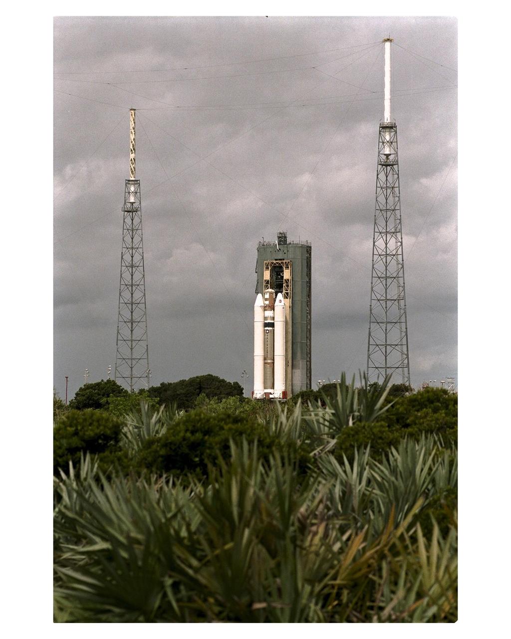 The Titan IVB core vehicle and its twin Solid Rocket Motor Upgrades (SRMUs) which will be used to propel the Cassini spacecraft to its final destination, Saturn, arrive at the pad at Launch Complex 40, Cape Canaveral Air Station. At the pad, the Centaur upper stage will be added and, eventually, the prime payload, the Cassini spacecraft. Cassini will explore the Saturnian system, including the planet’s rings and moon, Titan. Launch of the Cassini mission to Saturn is scheduled for Oct. 6