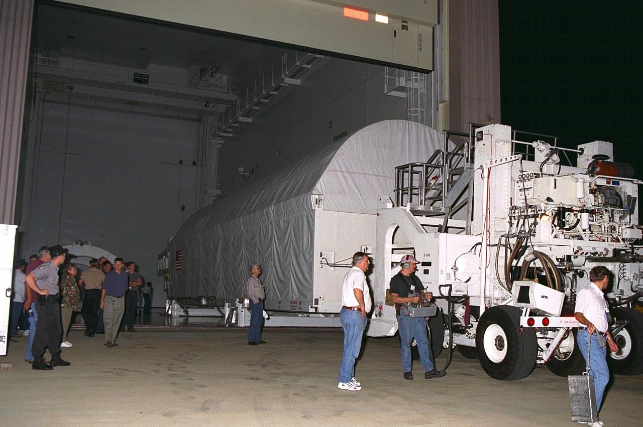The container transporting the Node 1, the first element of the International Space Station to be manufactured in the United States and the first to be launched on the Space Shuttle, is moved into the Space Station Processing Facility high bay June 23 after its arrival from NASA’s Marshall Space Flight Center (MSFC). The Node 1 module is currently scheduled to lift off aboard the Space Shuttle Endeavour in July 1998 along with Pressurized Mating Adapters (PMAs) 1 and 2. The 18-foot in diameter, 22-foot-long aluminum module was manufactured by the Boeing Co. at MSFC. Once in space, the Node 1 will function as a connecting passageway to the living and working areas of the International Space Station. It has six hatches that will serve as docking ports to the U.S. laboratory module, U.S. habitation module, an airlock and other space station elements