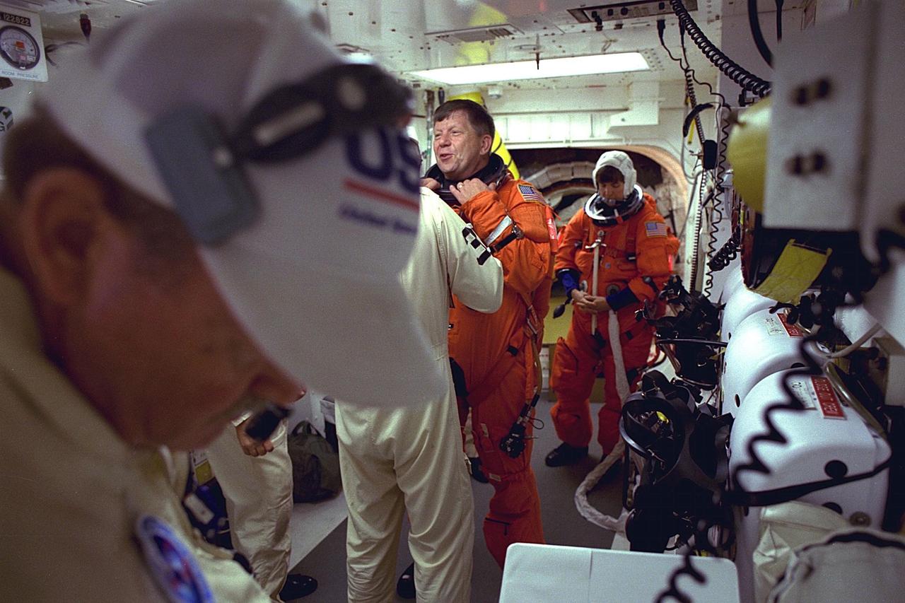 STS-94 Payload Specialist Roger K. Crouch prepares to enter the Space Shuttle Columbia at Launch Pad 39A in preparation for launch.  He is the Chief Scientist of  the NASA Microgravity Space and Applications Division. He also has served as a  Program Scientist for previous Spacelab microgravity  missions and is an expert in  semiconductor crystal growth. Since Crouch has more than 25 years of experience as a  materials scientist, he will be concentrating on the five physics of materials processing  experiments in the Middeck Glovebox  Facility on the Blue shift. He will also share the  workload with Thomas by monitoring the materials furnace experiments during this time.  Crouch and six fellow crew members will lift off  during a launch window that  opens at 1:50 p.m. EDT, July 1. The launch window will open 47 minutes early to  improve the opportunity to lift off before Florida summer rain showers reach the space  center