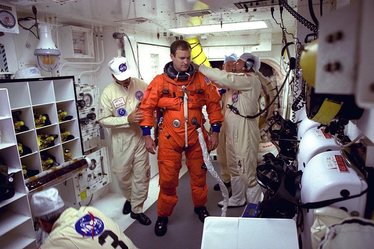 STS-94 Mission Commander James D. Halsell,  Jr., prepares to enter the Space Shuttle Columbia at Launch Pad 39A in preparation for launch.  Halsell is on his fourth space flight, having served as  commander of STS-83 and pilot of both  STS-74 and STS-65. He is a lieutenant colonel  in the Air Force  and a former SR-71 Blackbird test pilot and holds master’s degrees in  management and space operations. Halsell will have responsibility for the success of the  mission and will operate and maintain Columbia during the Red, or second shift. He will  also assist with a  materials science experiment and a protein crystal growth payload  during the 16-day mission. Halsell and six fellow crew members will lift off  during a launch window that opens at 1:50 p.m. EDT, July 1. The launch window will  open 47 minutes early to improve the opportunity to lift off before Florida summer rain  showers reach the space center