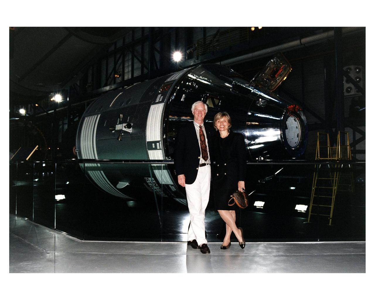 KENNEDY SPACE CENTER, FLA. -- Apollo 9 Lunar Module Pilot Russell L. Schweikart poses in front of an Apollo Command and Service Module in the the new Apollo/Saturn V Center (ASVC) at KSC prior to the gala grand opening ceremony for the facility that was held Jan. 8, 1997. Several Apollo astronauts were invited to participate in the event, which also featured NASA Administrator Dan Goldin and KSC Director Jay Honeycutt. The ASVC also features several other Apollo program spacecraft components, multimedia presentations and a simulated Apollo/Saturn V liftoff. The facility will be a part of the KSC bus tour that embarks from the KSC Visitor Center