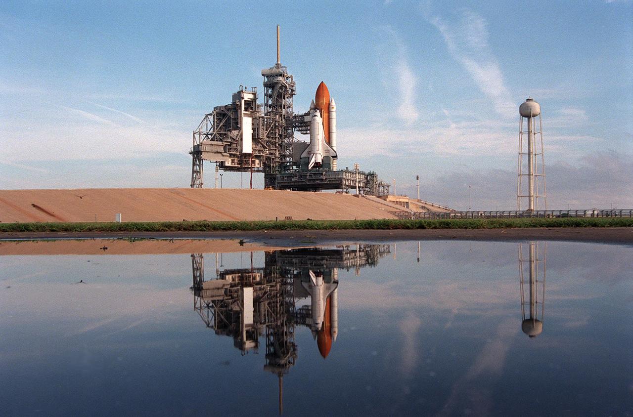 KENNEDY SPACE CENTER, Fla. -- With its rotating service structure (RSS) rotated back, the Space Shuttle Atlantis appears ready for flight at Launch Pad 39A. But there are still about three weeks of preparations until the planned launch of Mission STS-86 on Sept. 25. The RSS is rolled back to allow for the insertion of the major payload, the SPACEHAB Double Module, into the orbiter’s cargo bay. SPACEHAB will be used to transport items to and from the Russian Space Shuttle Mir on Mission STS-86, which will be the seventh docking of the Shuttle with the Mir. About three-and-a-half tons of science/logistical equipment and supplies will be exchanged between Atlantis and the Mir during the mission. STS-86 Mission Specialist David A. Wolf will transfer to the Russian space station, replacing NASA astronaut and Mir 24 crew member C. Michael Foale, who will return to Earth on Atlantis. Liftoff is targeted for Sept. 25