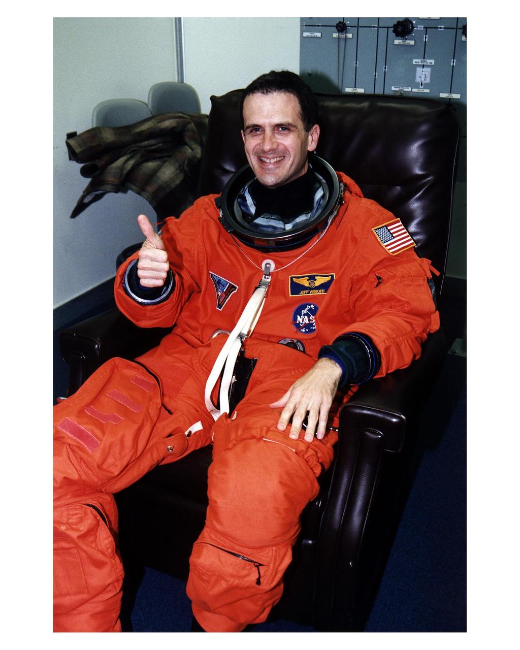 STS-81 Mission Specialist Peter J. K. "Jeff" Wisoff prepares for the fifth ShuttleMir docking as he waits in the Operations and Checkout (O&C) Building for the operation to fit him into his launch/entry suit to be completed. He conducted a spacewalk on his on his first Shuttle mission, STS57 and holds a doctorate degree in applied physics with an emphasis on lasers and semiconductor materials. He and five crew members will shortly depart the O&C and head for Launch Pad 39B, where the Space Shuttle Atlantis will lift off during a 7-minute window that opens at 4:27 a.m. EST, January 12