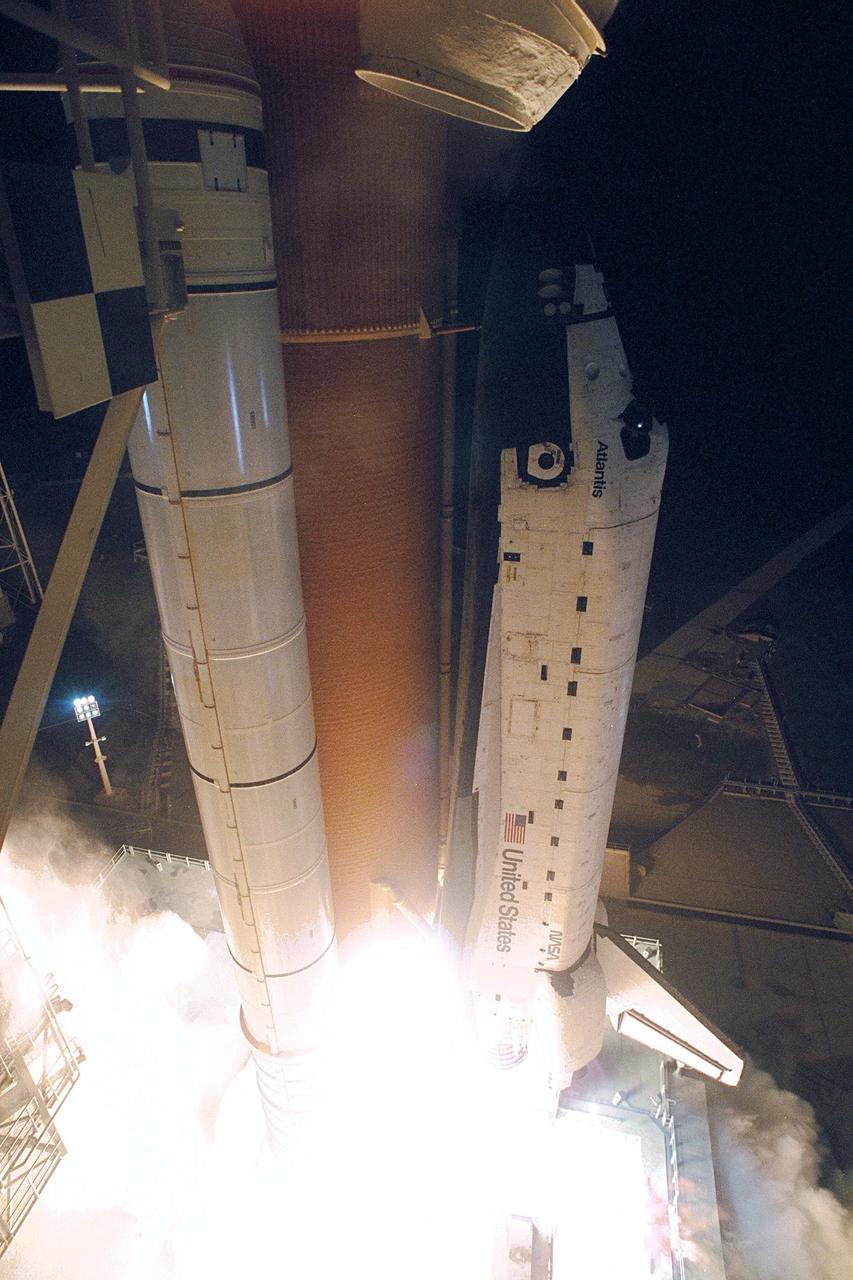 The Space Shuttle Atlantis blazes through the night sky to begin the STS-86 mission, slated to be the seventh of nine planned dockings of the Space Shuttle with the Russian Space Station Mir. Liftoff on Sept. 25 from Launch Pad 39A was at 10:34:19 p.m. EDT, within seconds of the preferred time, during a six-minute, 45-second launch window. The 10-day flight will include the transfer of the sixth U.S. astronaut to live and work aboard the Mir. After the docking, STS-86 Mission Specialist David A. Wolf will become a member of the Mir 24 crew, replacing astronaut C. Michael Foale, who will return to Earth aboard Atlantis with the remainder of the STS-86 crew. Foale has been on the Russian Space Station since mid-May. Wolf is scheduled to remain there about four months. Besides Wolf (embarking to Mir) and Foale (returning), the STS-86 crew includes Commander James D. Wetherbee, Pilot Michael J. Bloomfield, and Mission Specialists Wendy B. Lawrence, Scott E. Parazynski, Vladimir Georgievich Titov of the Russian Space Agency, and Jean-Loup J.M. Chretien of the French Space Agency, CNES. Other primary objectives of the mission are a spacewalk by Parazynski and Titov, and the exchange of about three-and-a-half tons of science/logistical equipment and supplies between Atlantis and the Mir