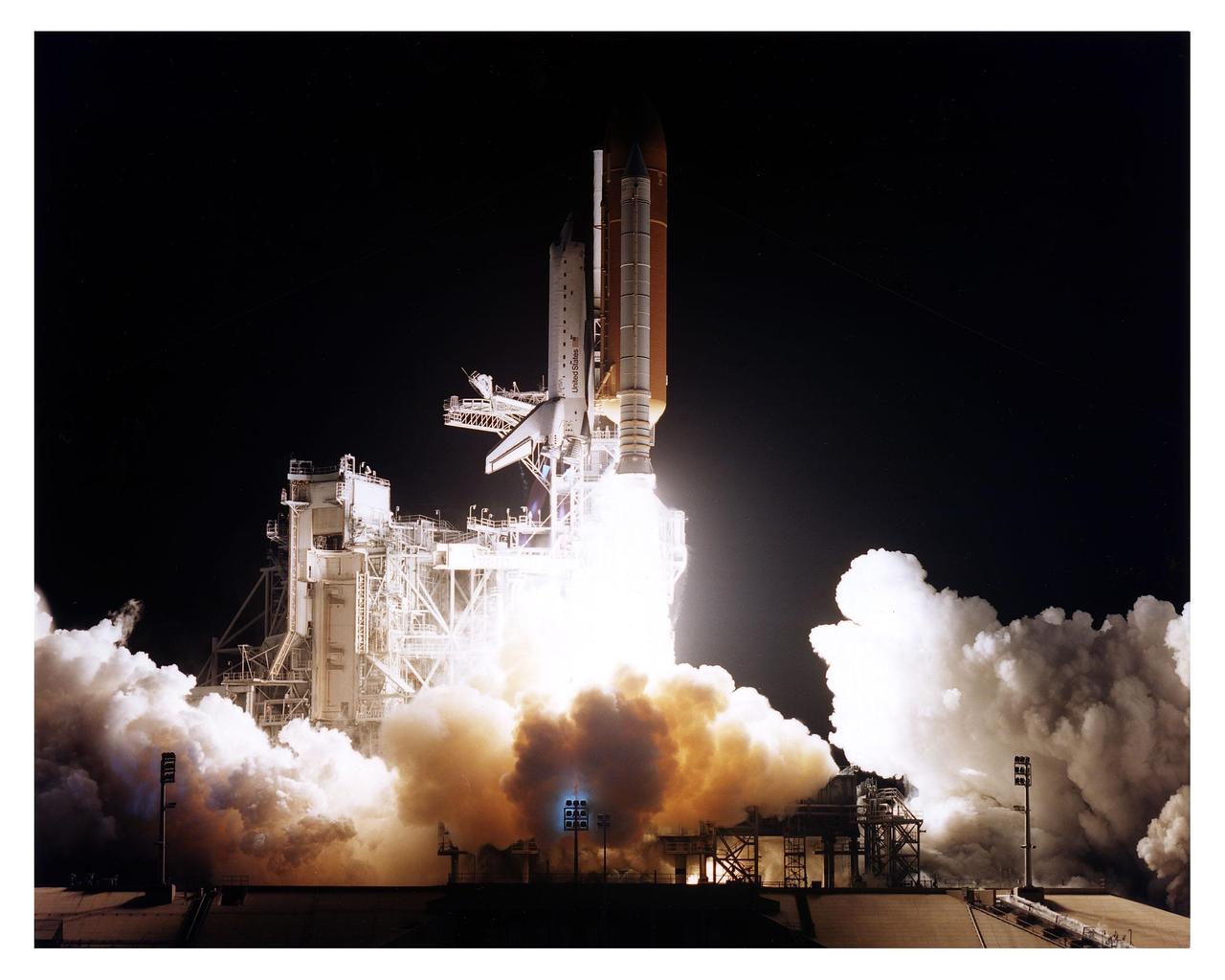 The Space Shuttle Atlantis transforms the early morning at KSC into near-daylight as its more than 7 million pounds of rocket thrust propels it from Launch Pad 39B at 4:27:23 a.m. EST Jan. 12 on its way to dock with the Mir space station for the fifth time.The 10-day mission will feature the transfer of Mission Specialist Jerry Linenger to Mir to replace astronaut John Blaha, who has been on the orbital laboratory since Sept. 19, 1996. The other STS-81 crew members include Mission Commander Michael A. Baker; Pilot Brent W. Jett, Jr.; and Mission Specialists John M. Grunsfeld, Peter J. K. "Jeff" Wisoff and Marsha S. Ivins. During the five-day docking operations, the Shuttle and Mir crews will conduct risk mitigation, human life science, microgravity and materials processing experiments that will provide data for the design, development and operation of the International Space Station. The primary payload is the SPACEHAB-DM double module that will provide space for more than 2,000 pounds of hardware, food and water that will be transferred into the Russian space station. The SPACEHAB will also be used to return experiment samples from the Mir to Earth for analysis and for microgravity experiments during the mission