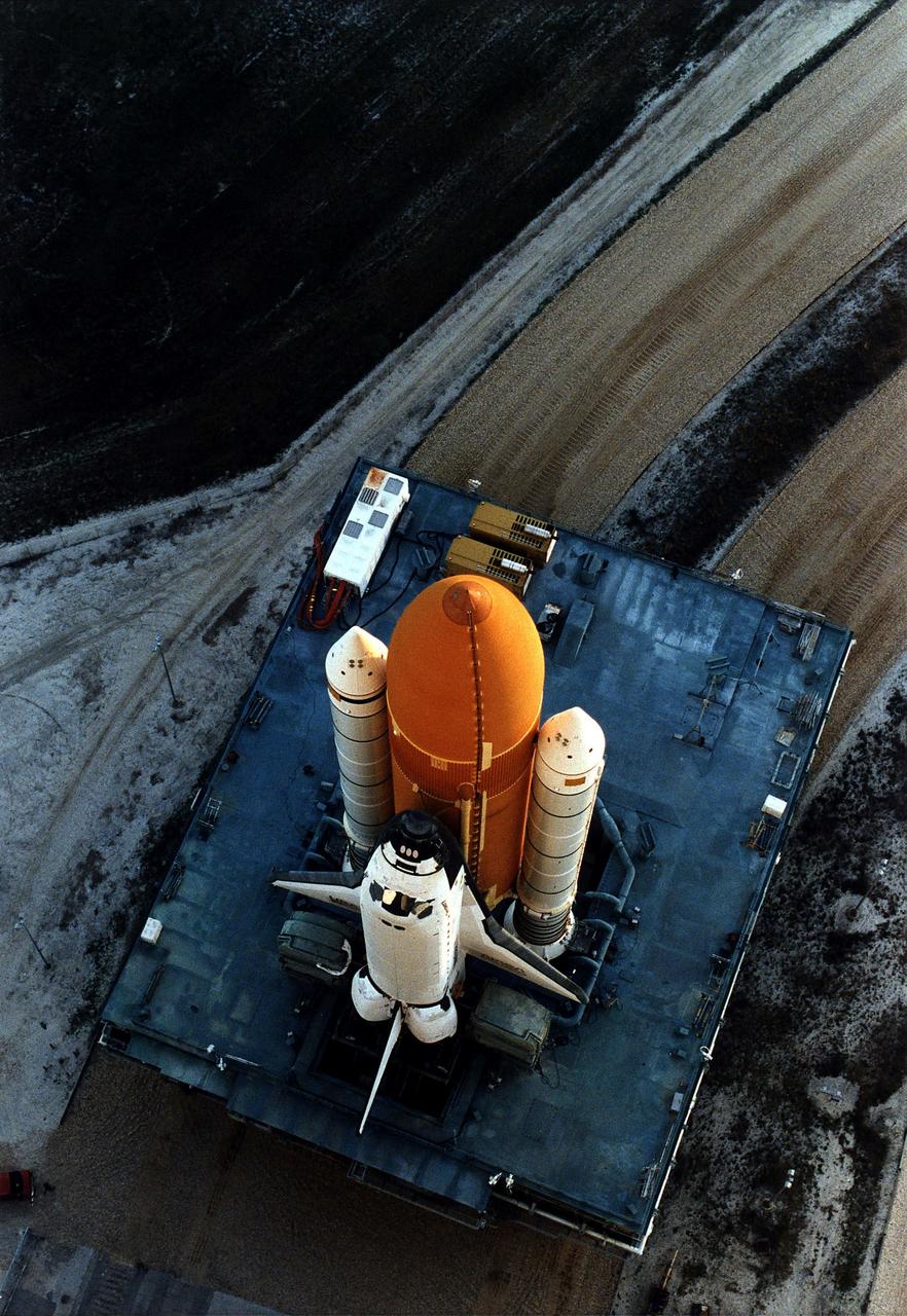 KENNEDY SPACE CENTER, FLA. -  The Space Shuttle Discovery on its Mobile Launcher Platform slowly moves through the high bay doors of the Vehicle Assembly Building en route to Launch Pad 39A, where Discovery is scheduled to lift off on the STS-82 mission on Feb. 11.  A seven-member crew will perform the second servicing of the orbiting Hubble Space Telescope (HST) during the 10-day STS-82 mission.