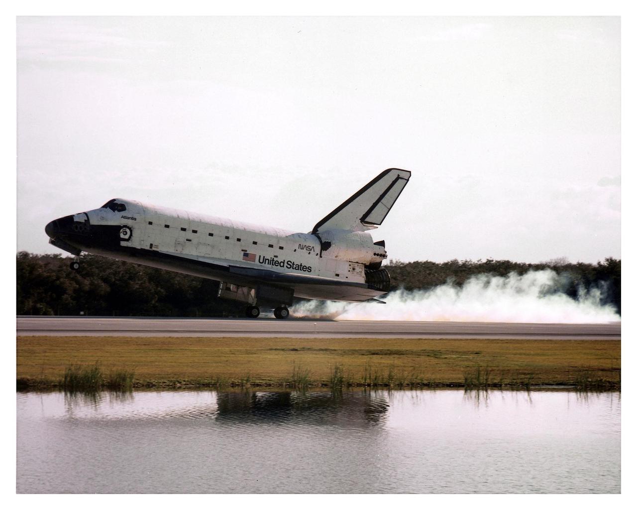 The Space Shuttle orbiter Atlantis touches down on Runway 33 at 9:22:44 a.m. EST Jan. 22 to conclude the fifth Shuttle-Mir docking mission and return NASA astronaut John Blaha to Earth after four months in space. Blaha was replaced by STS-81 Mission Specialist Jerry Linenger during the five days of docked operations. At main gear touchdown, the STS-81 mission duration was 10 days, 4 hours, 55 minutes. This was the 34th KSC landing in Shuttle history. Mission Commander Michael A. Baker flew Atlantis to a perfect landing, with help from Pilot Brent W. Jett, Jr. Other returning STS-81 crew members are Mission Specialists John M. Grunsfeld, Peter J. K. "Jeff" Wisoff and Marsha S. Ivins. Atlantis also brought back experiment samples from the Russian space station for analysis on Earth, along with Russian logistics equipment