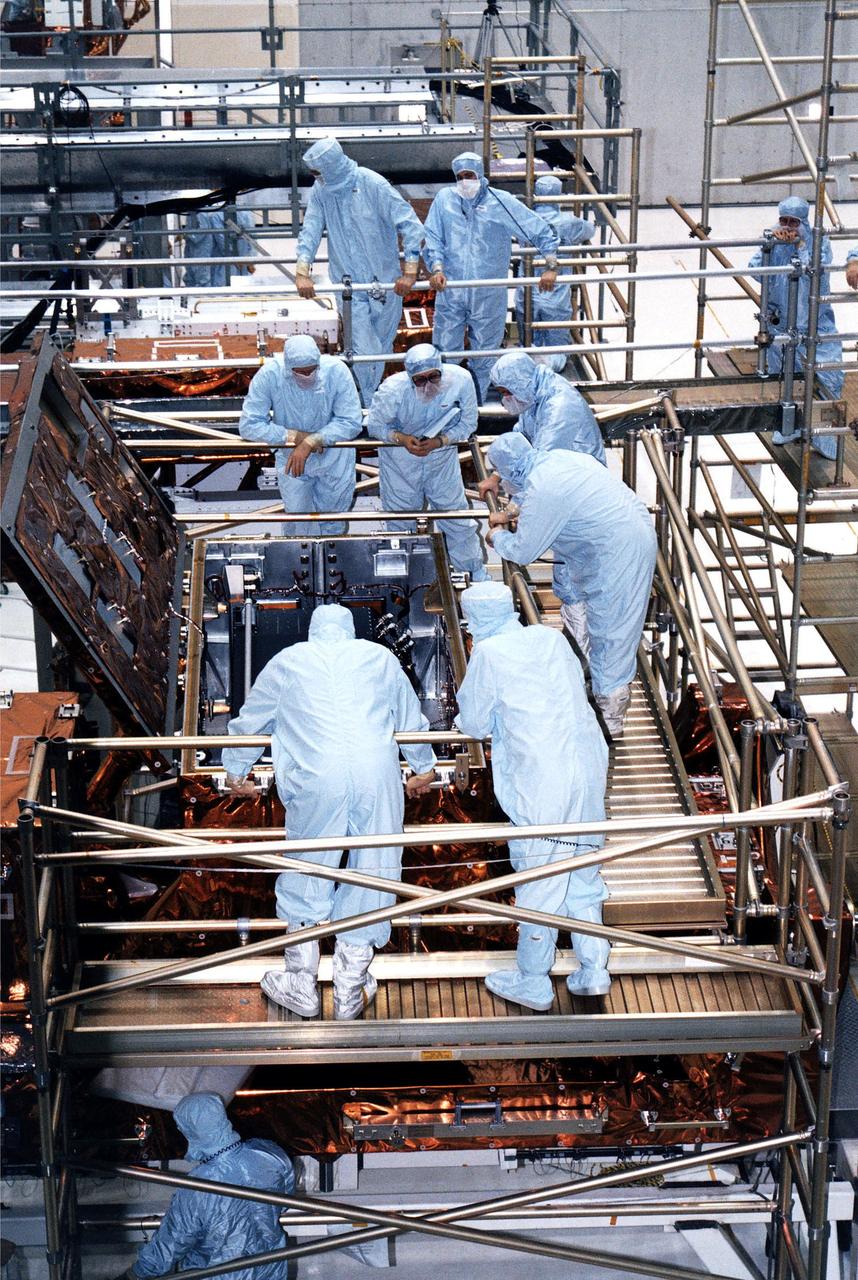 KENNEDY SPACE CENTER, FLA. -  STS-82 crew members and workers at KSC's Vertical Processing Facility get a final look at the Near Infrared Camera and Multi-Object Spectrometer (NICMOS) in its flight configuration for the STS-82 mission.  The crew is participating in the Crew Equipment Integration Test (CEIT).  NICMOS is one of two new scientific instruments that will replace two outdated instruments on the Hubble Space Telescope (HST).  NICMOS will provide HST with the capability for infrared imaging and spectroscopic observations of astronomical targets.  The refrigerator-sized NICMOS also is HST's first cryogenic instrument - its sensitive infrared detectors must operate at very cold temperatures of minus 355 degrees Fahrenheit or 58 degrees Kelvin.  NICMOS will be installed in Hubble during STS-82, the second Hubble Space Telescope servicing mission.  Liftoff is scheduled Feb. 11 aboard Discovery with a crew of seven.
