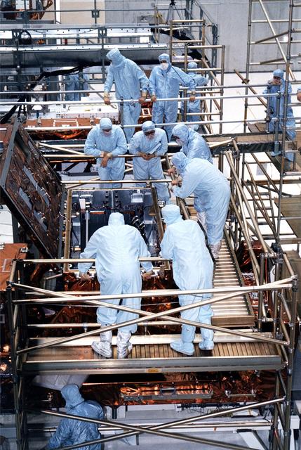 KENNEDY SPACE CENTER, FLA. -  STS-82 crew members and workers at KSC's Vertical Processing Facility get a final look at the Near Infrared Camera and Multi-Object Spectrometer (NICMOS) in its flight configuration for the STS-82 mission.  The crew is participating in the Crew Equipment Integration Test (CEIT).  NICMOS is one of two new scientific instruments that will replace two outdated instruments on the Hubble Space Telescope (HST).  NICMOS will provide HST with the capability for infrared imaging and spectroscopic observations of astronomical targets.  The refrigerator-sized NICMOS also is HST's first cryogenic instrument - its sensitive infrared detectors must operate at very cold temperatures of minus 355 degrees Fahrenheit or 58 degrees Kelvin.  NICMOS will be installed in Hubble during STS-82, the second Hubble Space Telescope servicing mission.  Liftoff is scheduled Feb. 11 aboard Discovery with a crew of seven.