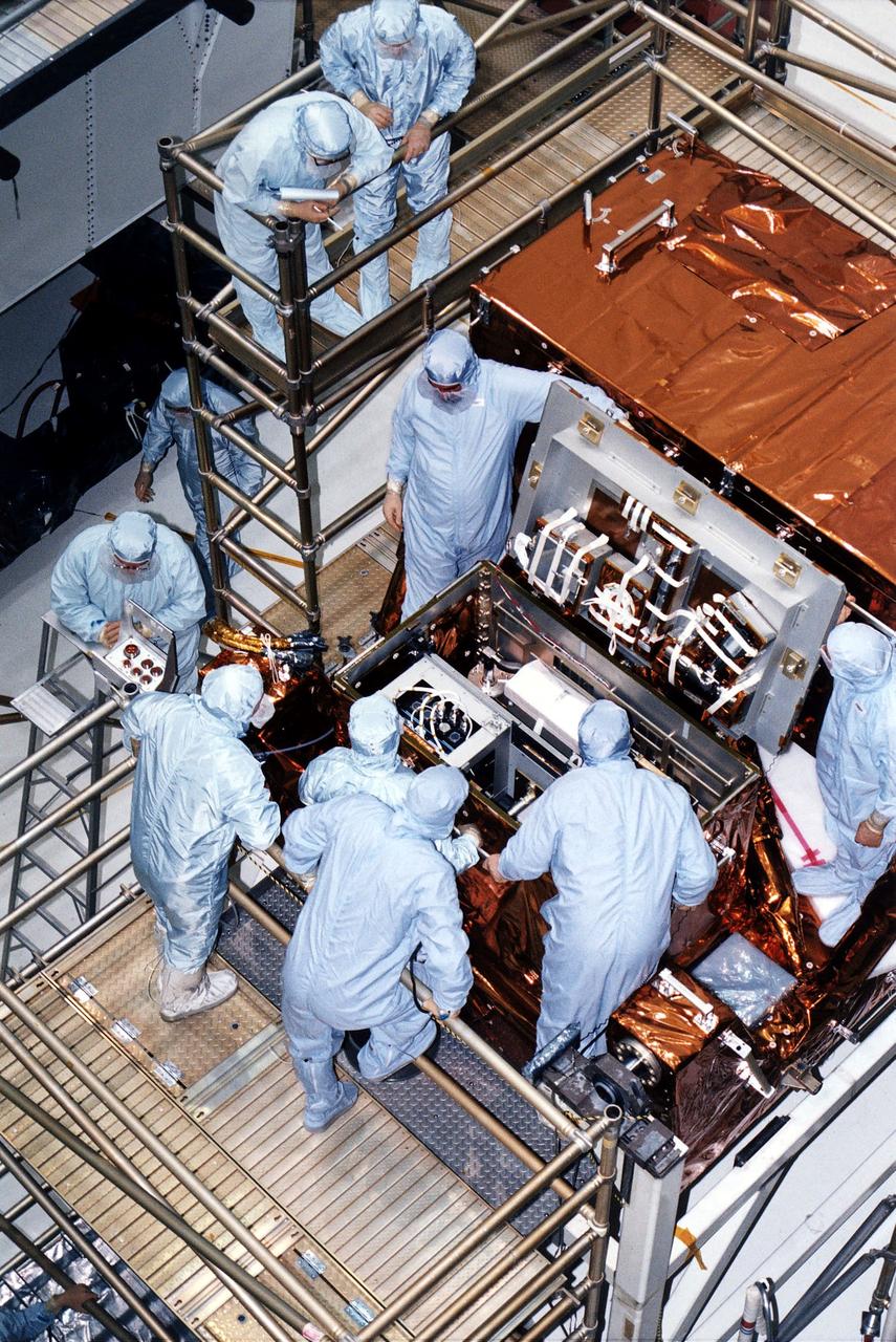 KENNEDY SPACE CENTER, FLA. -  STS-82 crew members and workers at KSC's Vertical Processing Facility look at hardware in the Multipurpose ORU (Orbital Replacement Unit) Protective Enclsoure, also called MOPE.  The crew is participating in the Crew Equipment Integration Test (CEIT).    Liftoff of STS-82, the second Hubble Space Telescope (HST) servicing mission, is scheduled Feb. 11 aboard Discovery with a crew of seven.