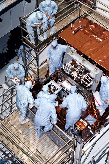NASA image: KENNEDY SPACE CENTER, FLA. -  STS-82 crew members and workers at KSC's Vertical Processing Facility look at hardware in the Multipurpose ORU (Orbital Replacement Unit) Protective Enclsoure, also called MOPE.  The crew is participating in the Crew Equipment Integration Test (CEIT).    Liftoff of STS-82, the second Hubble Space Telescope (HST) servicing mission, is scheduled Feb. 11 aboard Discovery with a crew of seven.
