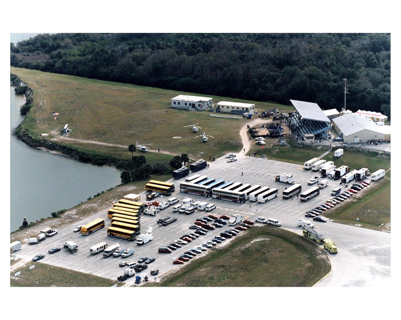The filming of scenes for the movie "Contact" by Warner Bros.' cast and crew at Kennedy Space Center's Launch Complex 39 Press Site on January 29 is captured by cameras on the roof of the Vehicle Assembly Building. The screenplay for "Contact" is based on the best-selling novel by the late astronomer Carl Sagan. The cast includes Jodie Foster, Matthew McConaughey, John Hurt, James Woods, Tom Skerritt, David Morse, William Fichtner, Rob Lowe and Angela Bassett. Described by Warner Bros. as a science fiction drama, "Contact" will depict humankind's first encounter with evidence of extraterrestrial life