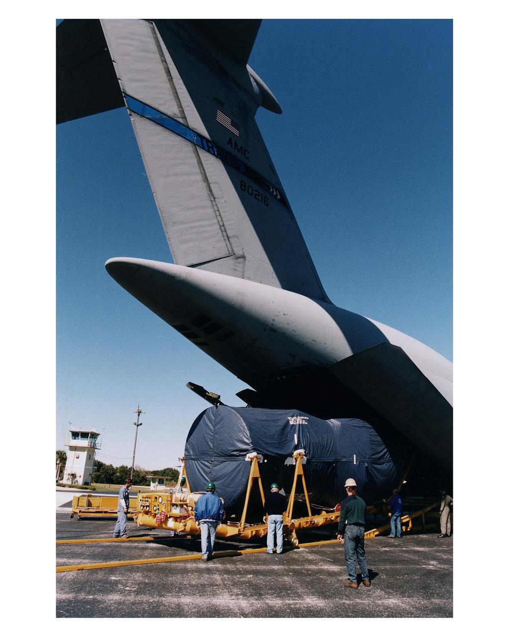 The Centaur upper stage of the Titan IV expendable launch vehicle that will propel the Cassini spacecraft to Saturn and its moon Titan is unloaded from a jet cargo aircraft at the Skid Strip at Cape Canaveral Air Station (CCAS). The Titan IV is currently scheduled to lift off from Launch Pad 40 at CCAS on October 6. Once deployed from the Centaur upper stage, Cassini will conduct gravity-assist flybys of the planets Venus and Jupiter, then arrive at Saturn in July 2004. Once there, it will perform an orbital survey of Saturn and send the European Space Agency's Huygens Probe into the dense and seemingly Earthlike atmosphere of Titan. The Cassini project is managed by NASA's Jet Propulsion Laboratory (JPL), Pasadena, California