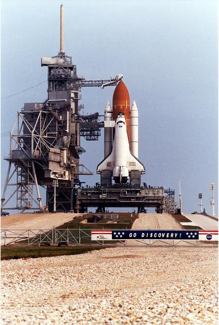 NASA image: KENNEDY SPACE CENTER, FLA. -  The Rotating Service Structure has been retracted at KSC's Launch Pad 39A.   Discovery, the orbiter for the STS-82 mission, is ready for the launch of the second Hubble Space Telescope service mission.  The payload consists of the Near Infrared Camera and Multi-Object Spectrometer (NICMOS) that will be installed, Fine Guidance Sensor #1 (FGS-1), and the Space Telescope Imaging Spectrograph (STIS) to be installed. The STS-82 will launch with a crew of seven at 3:54 a.m. EST, Feb. 11, 1997. The launch window is 65 minutes in duration. The Mission Commander for STS-82 is Ken Bowersox. The purpose of the mission is to upgrade the scientific capabilities, service or replace aging components on the Telescope, and provide a reboost to the optimum altitude.