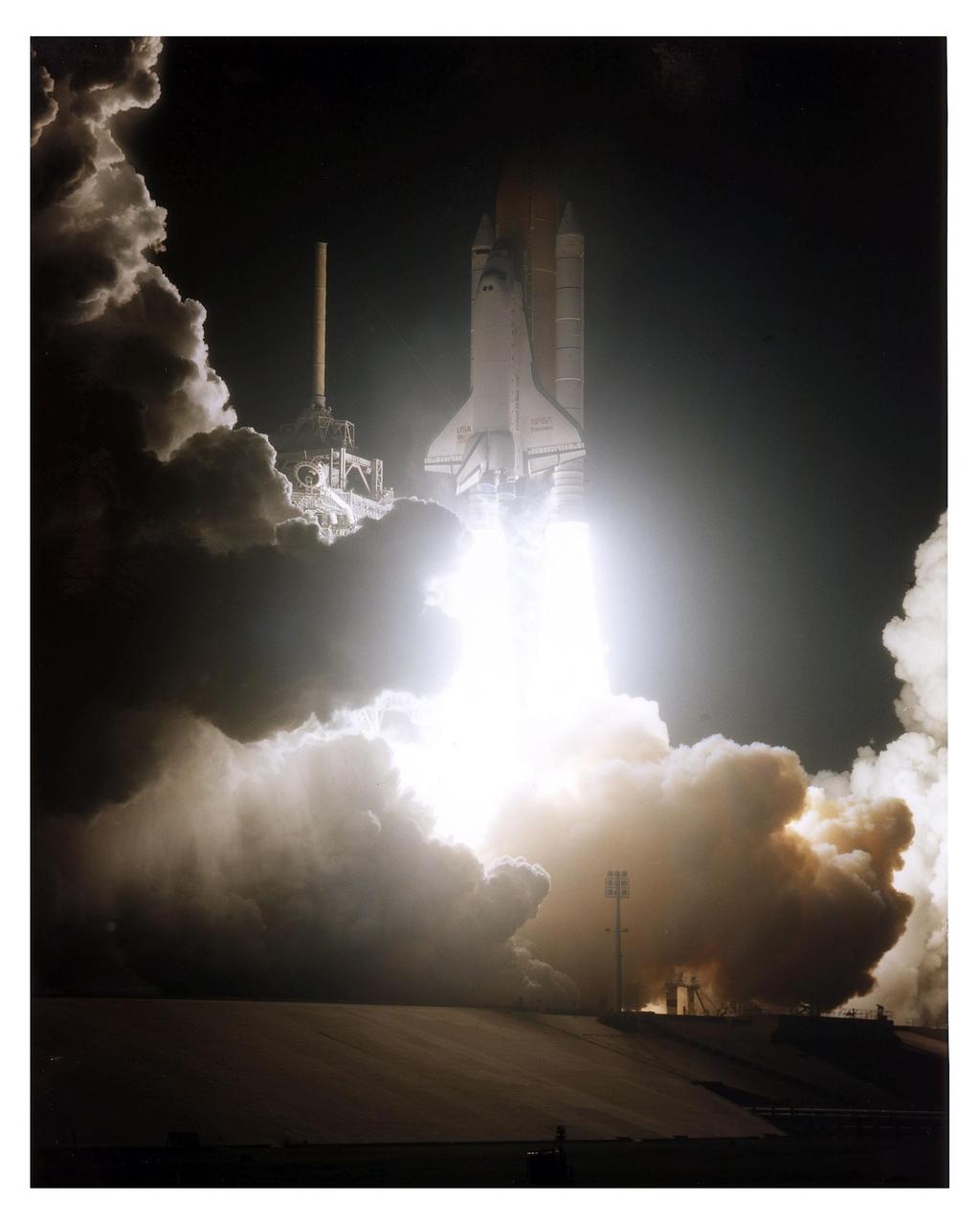 The Space Shuttle Discovery cuts a bright swath through the early-morning darkness as it lifts off from Launch Pad 39A on a scheduled 10-day flight to service the Hubble Space Telescope (HST). Liftoff of Mission STS-82 occurred on-time at 3:55:17 a.m. EST, Feb. 11, 1997. Leading the veteran crew is Mission Commander Kenneth D. Bowersox. Scott J. "Doc" Horowitz is the pilot. Mark C. Lee is the payload commander. Rounding out the seven-member crew are Mission Specialists Steven L. Smith, Gregory J. Harbaugh, Joseph R. "Joe" Tanner and Steven A. Hawley. Four of the astronauts will be divided into two teams to perform the scheduled four back-to-back extravehicular activities (EVAs) or spacewalks. Lee and Smith will team up for EVAs 1 and 3 on flight days 4 and 6; Harbaugh and Tanner will perform EVAs 2 and 4 on flight days 5 and 7. Among the tasks will be to replace two outdated scientific instruments with two new instruments the Space Telescope Imaging Spectrograph (STIS) and the Near Infrared Camera and Multi-Object Spectrometer (NICMOS). This is the second servicing mission for HST, which was originally deployed in 1990 and designed to be serviced on-orbit about every three years. Hubble was first serviced in 1993. STS-82 is the second of eight planned flights in 1997. It is the 22nd flight of Discovery and the 82nd Shuttle mission